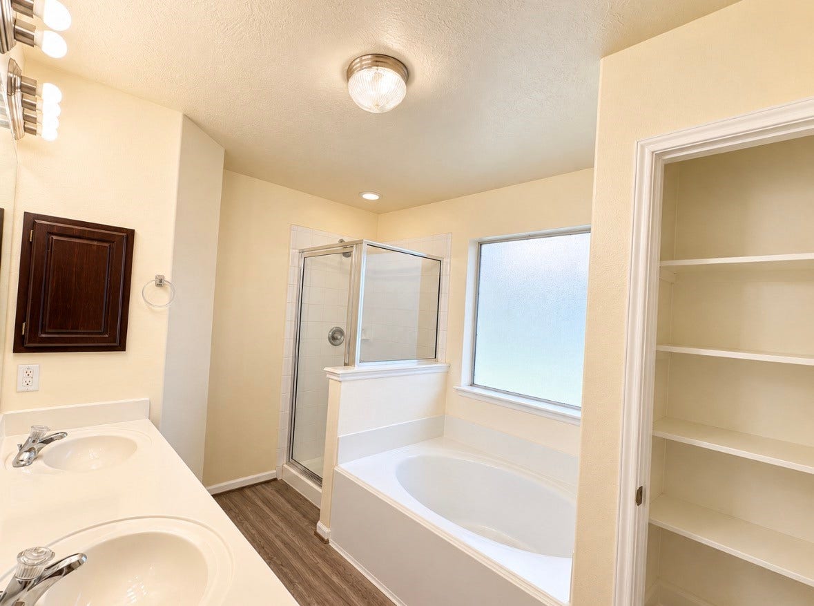 3722 Elderberry Drive, Dickinson, TX 77539 Unwind in your soaking tub after a long day, with a separate shower & convenient storage nearby.