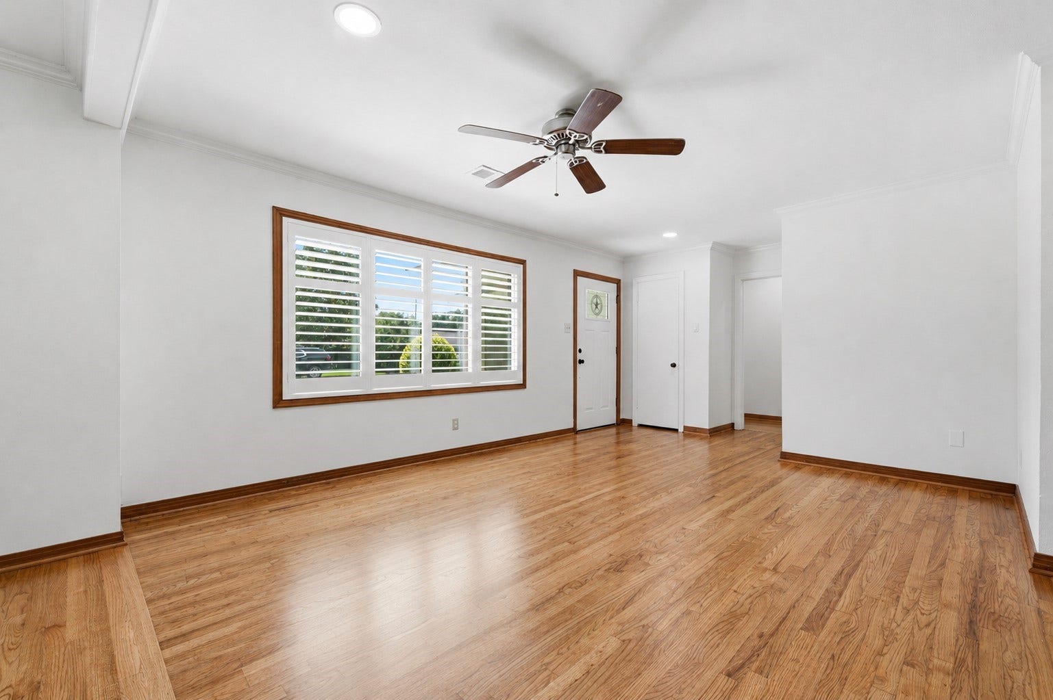 410 Kyle Street, Sugar Land, TX 77478 From the entry, the bedrooms are tucked to the left, while the living and entertaining spaces unfold to the right, creating a thoughtful separation of public and private areas.