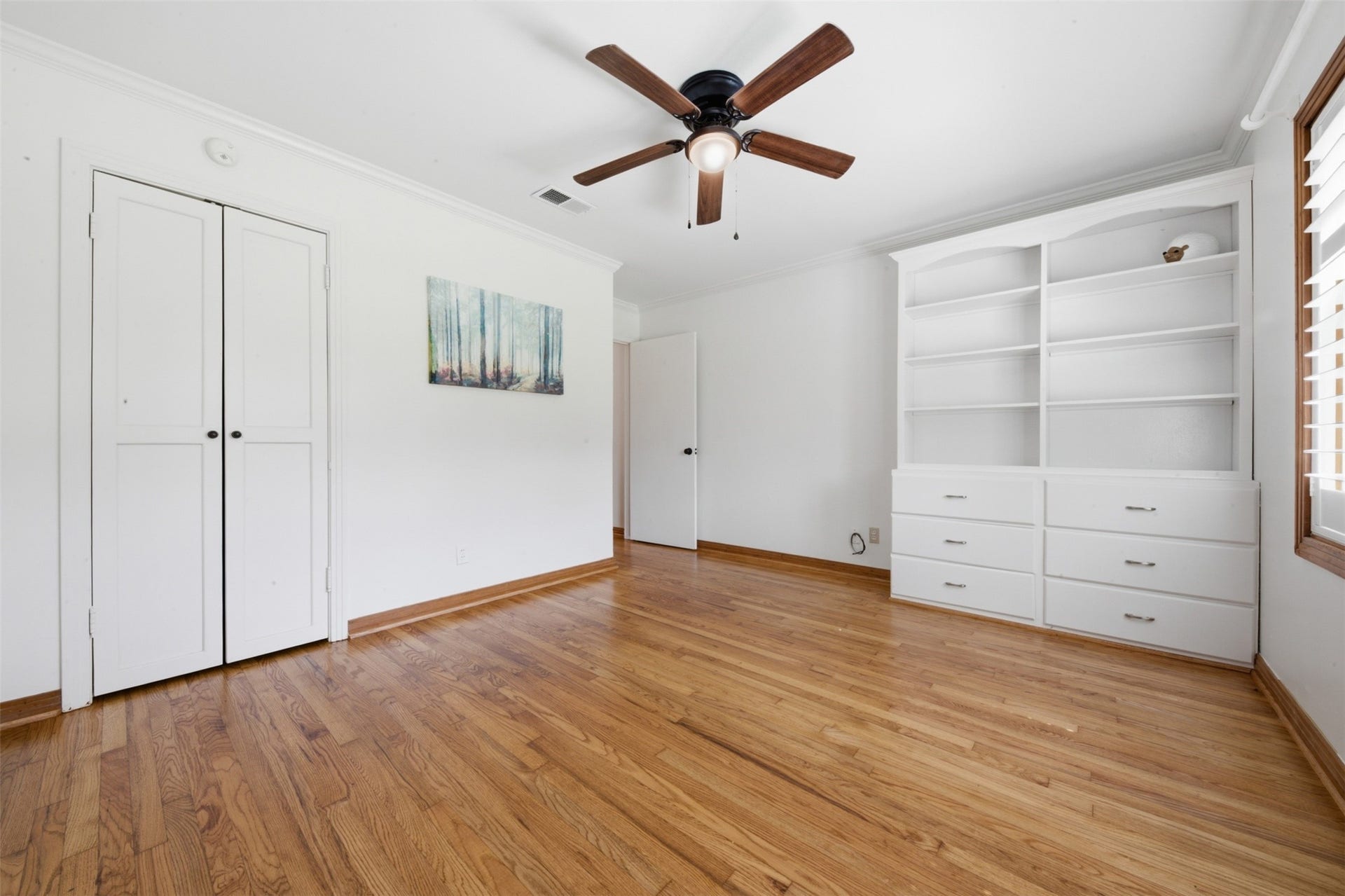 410 Kyle Street, Sugar Land, TX 77478 A closer look at the custom built-in drawers and shelving reveals exceptional storage and display space in Bedroom 2.