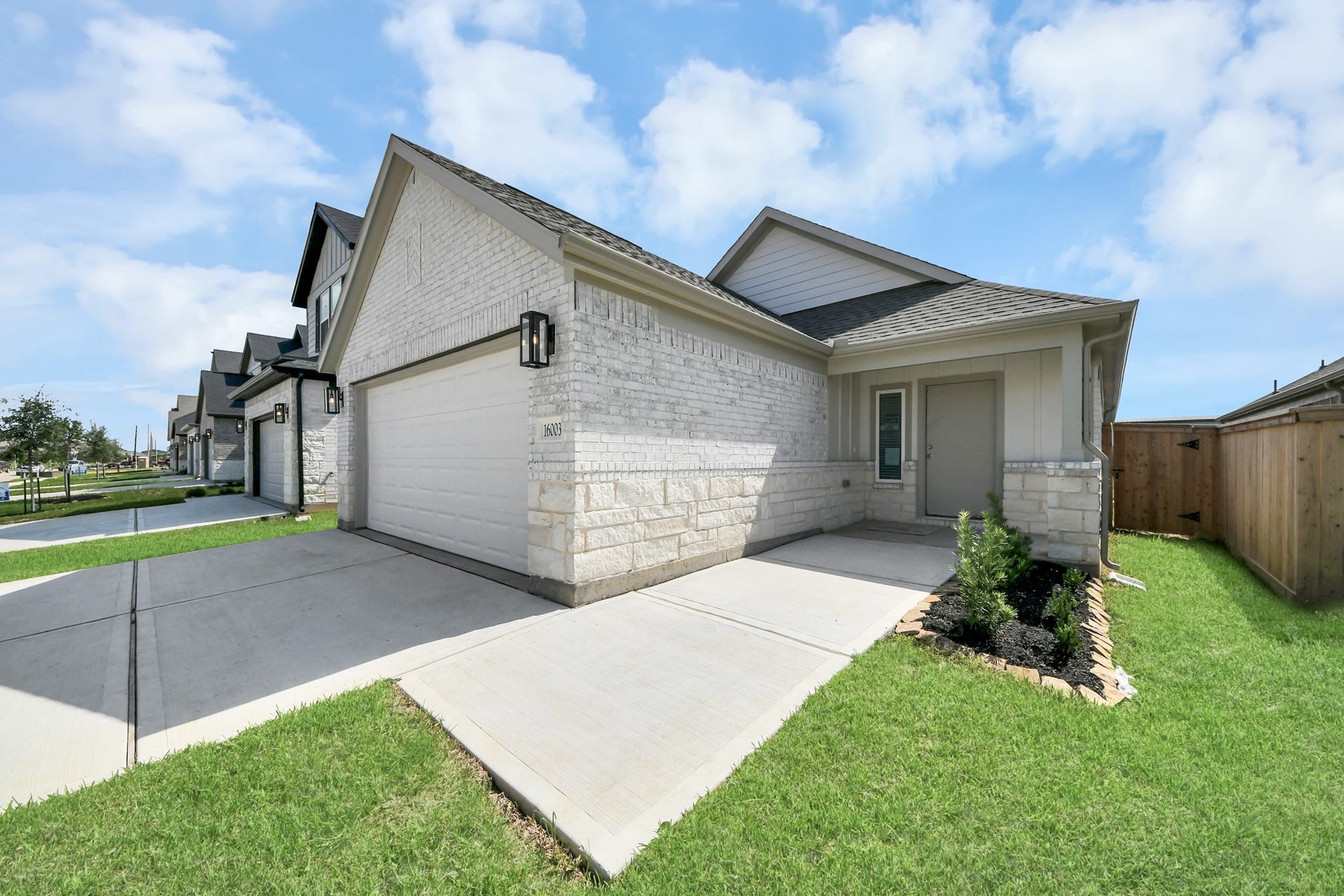 16003 Sycamore Maple Lane, Cypress, TX 77429 Home features a convenient 2-car garage complemented by a spacious driveway, offering ample parking for you and your guests.