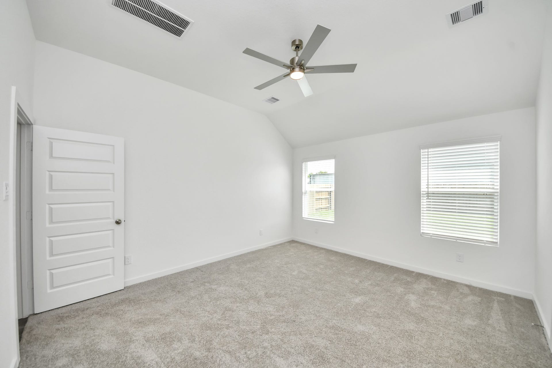 16003 Sycamore Maple Lane, Cypress, TX 77429 Escape to tranquility in this spacious primary room, adorned with plush carpeting and bathed in the soothing hues of warm paint colors, creating a cozy retreat for relaxation.