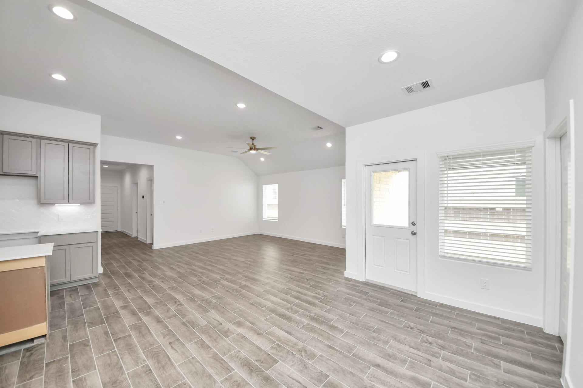 16003 Sycamore Maple Lane, Cypress, TX 77429 Create lasting memories with your family and friends at the dining table! This expansive dining room showcases sophisticated flooring, custom paint, and seamlessly connects to the family room and kitchen, providing an open and inviting atmosphere