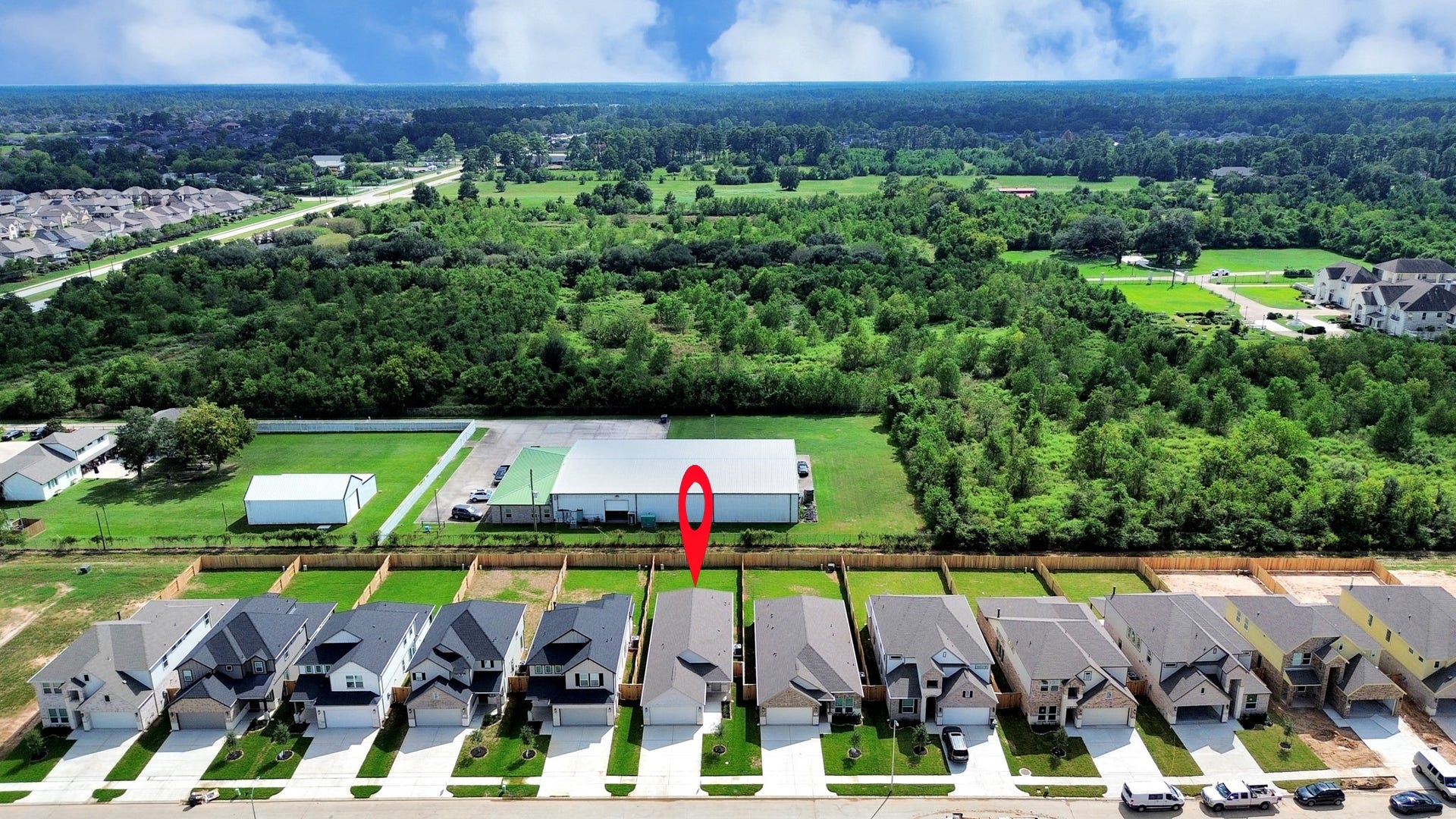 16003 Sycamore Maple Lane, Cypress, TX 77429 An aerial view of a spacious subdivision lot, highlighting a well-maintained yard and a fully fenced perimeter, offering both privacy and expansive outdoor space.