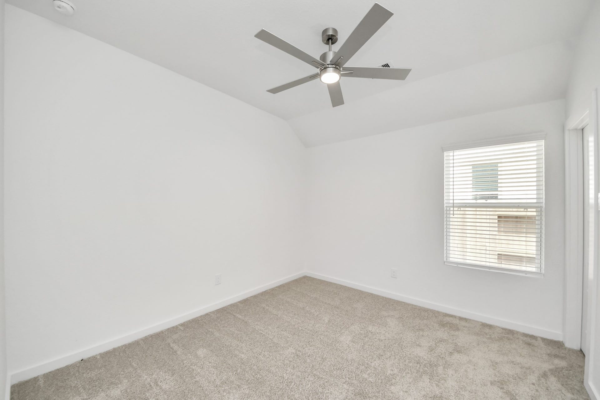 16003 Sycamore Maple Lane, Cypress, TX 77429 Secondary bedroom features plush carpeting, large windows that let in plenty of natural light, bright paint, and spacious closets.