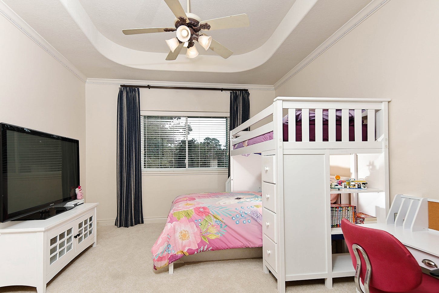 10 Snow Pond Place, The Woodlands, TX 77382 Bedroom 2 is spacious, featuring a recessed ceiling, crown molding, large window with drapery, and walk-in closet.