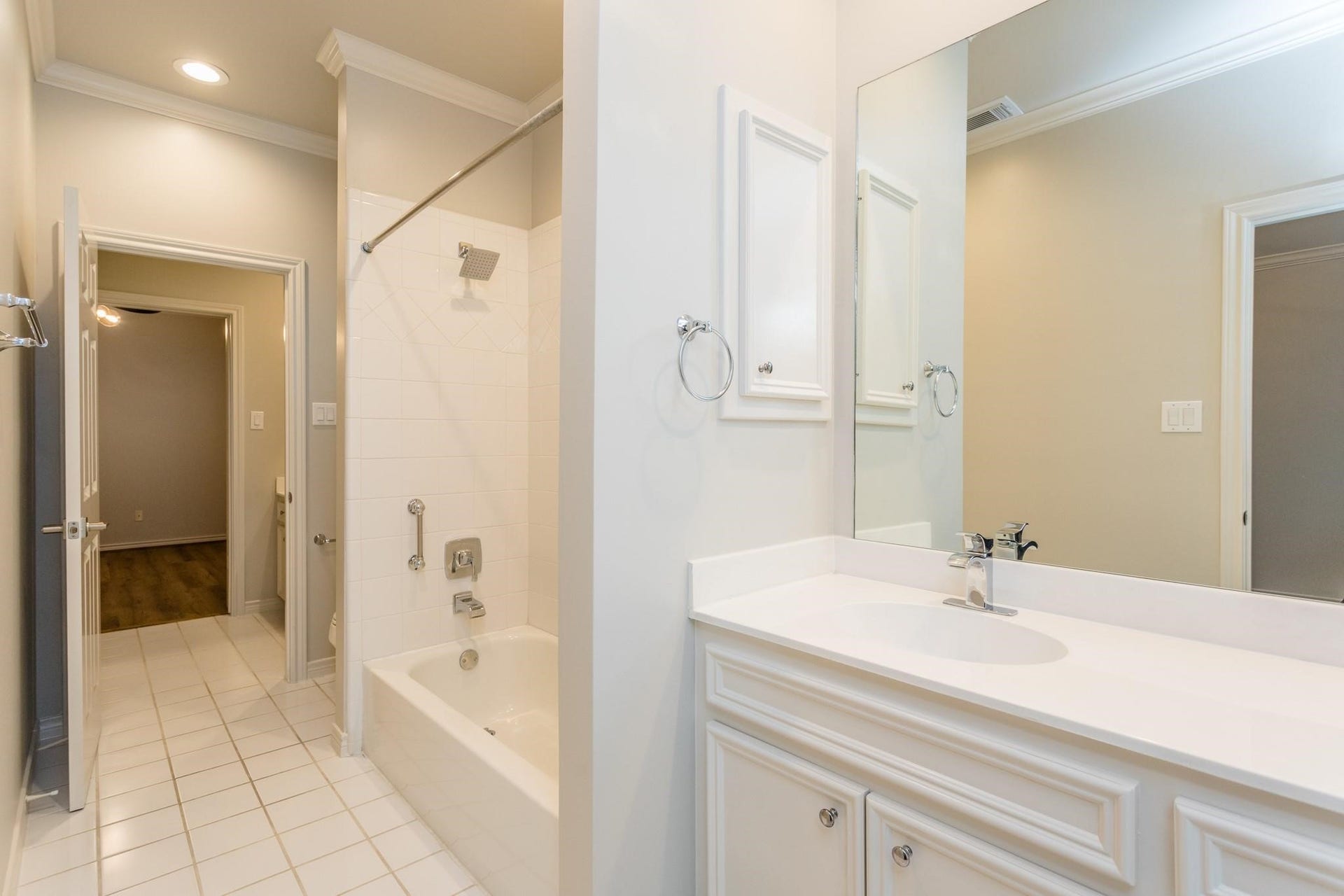 Secondary bathroom includes combined shower/bath.