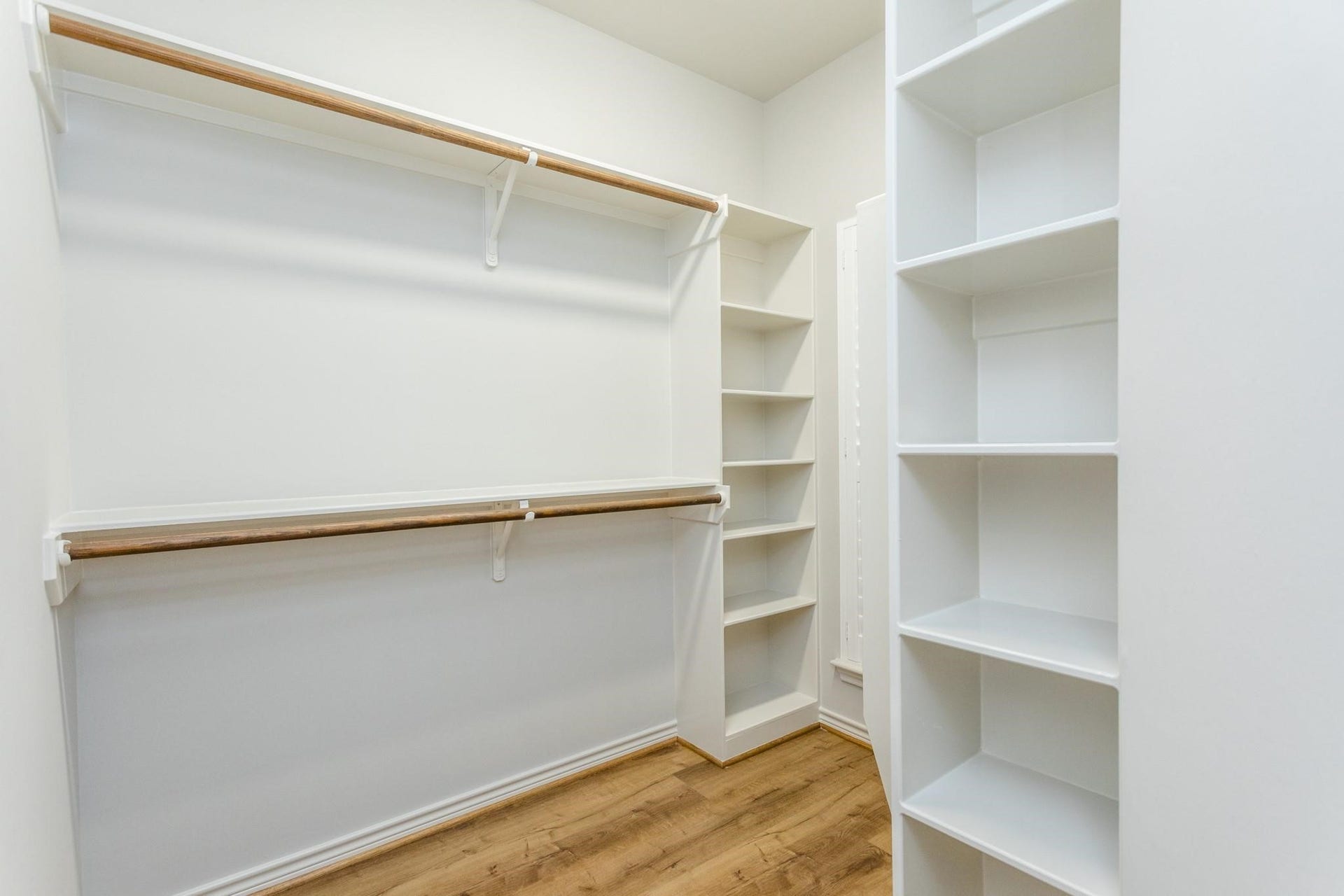 Large walk-in primary closet.