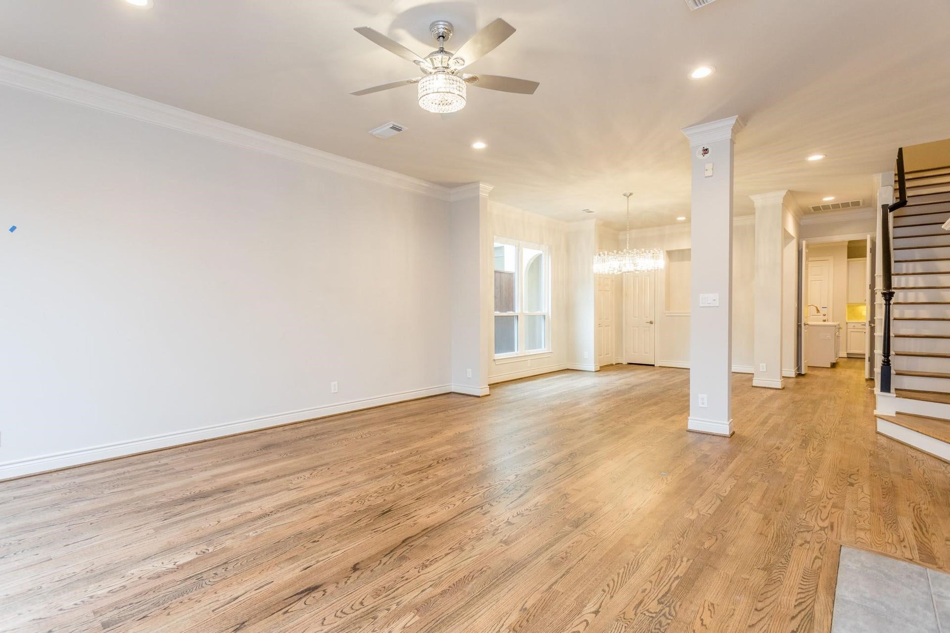 Open-floor concept seamlessly connects living room, dining and entryway.