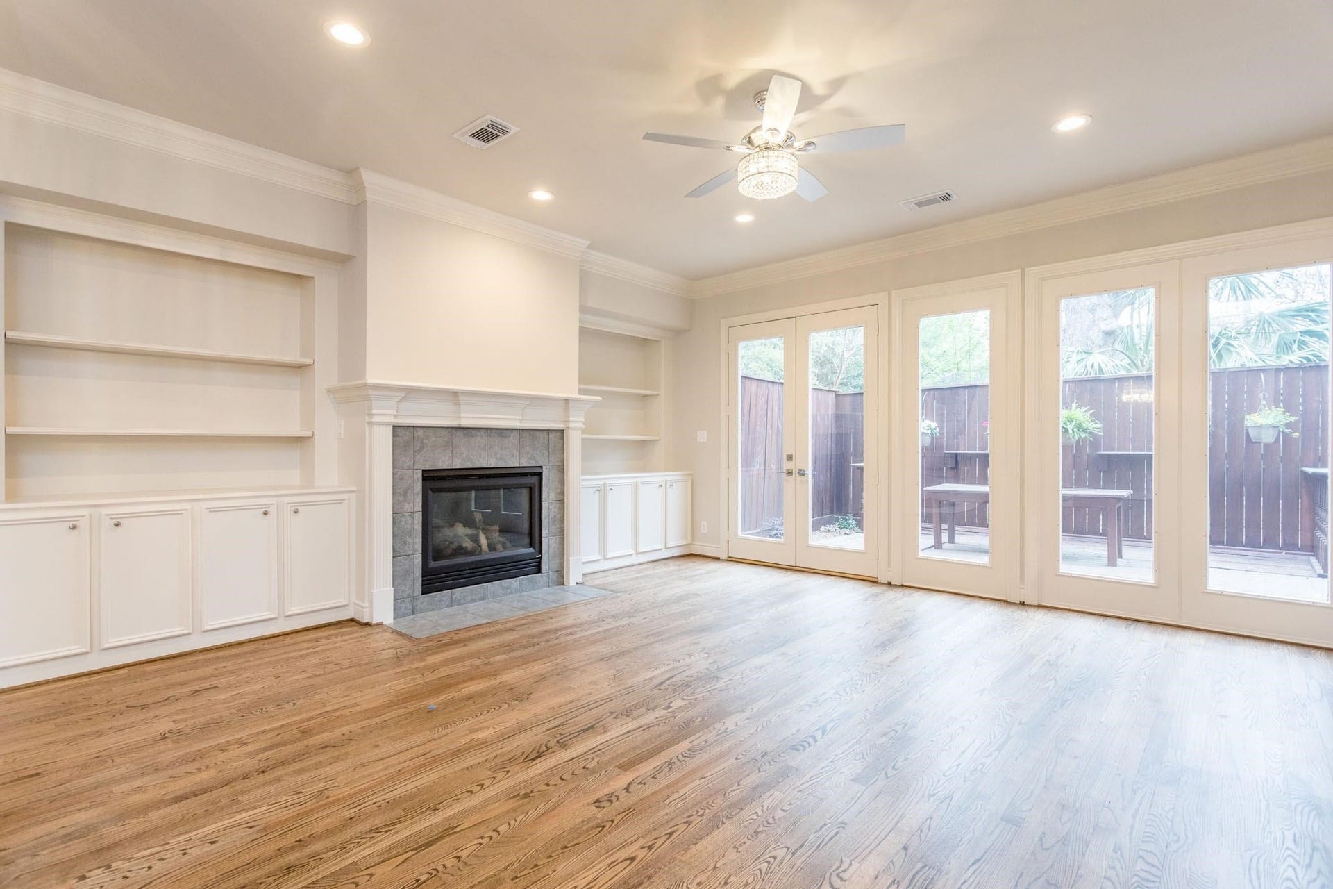 Large living / family room with abundant natural light and gas log fireplace.
