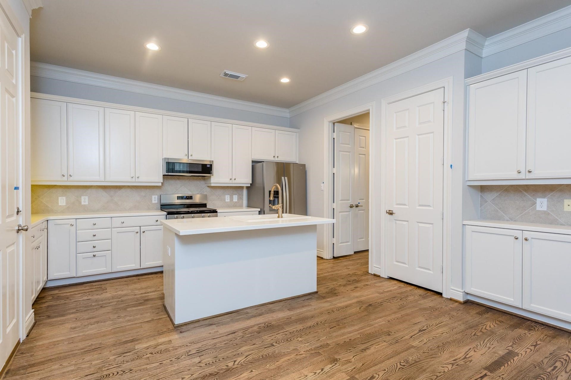 Kitchen includes designated coffee and breakfast bar.