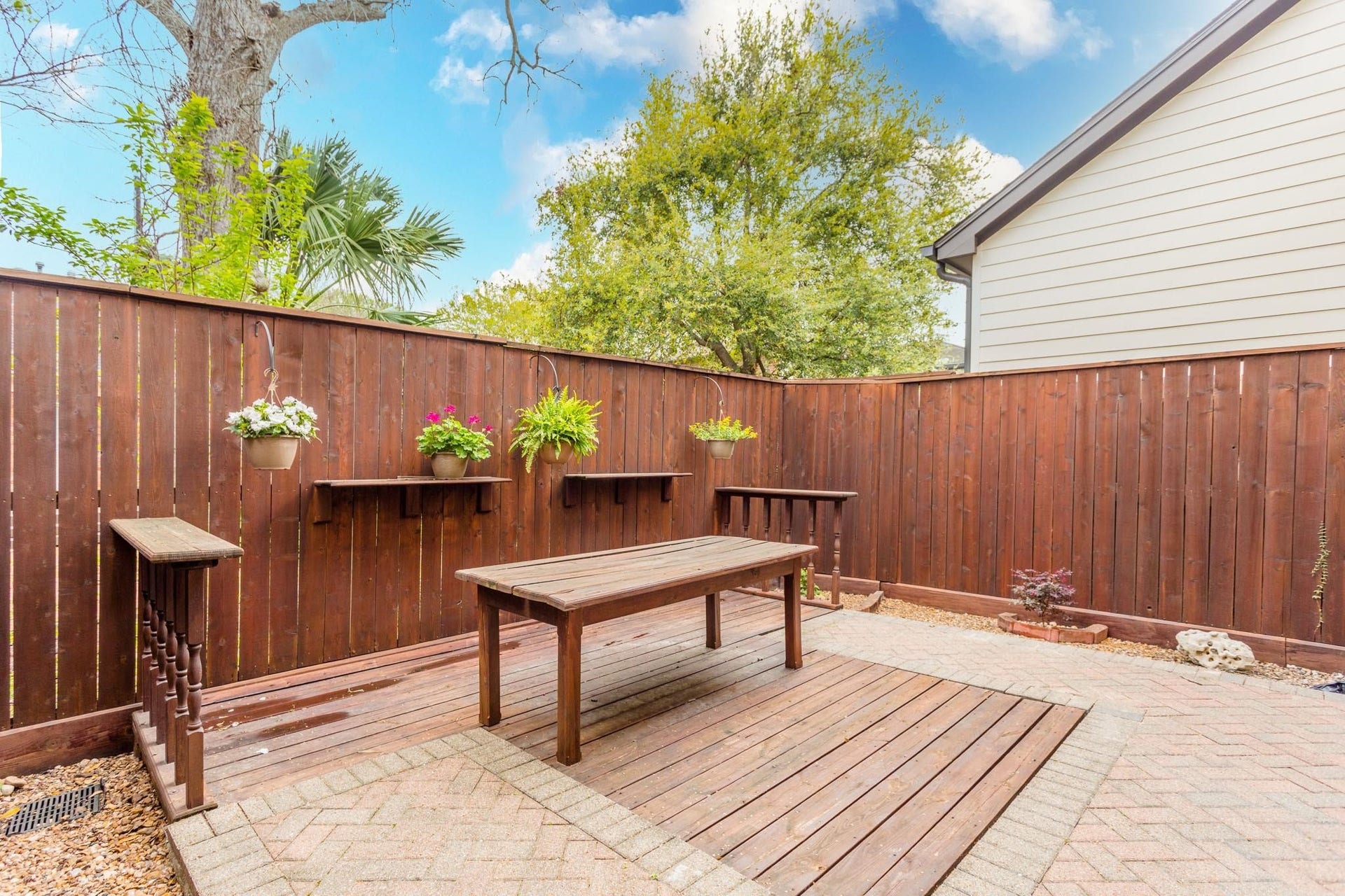 Private fenced backyard patio perfect for entertaining.