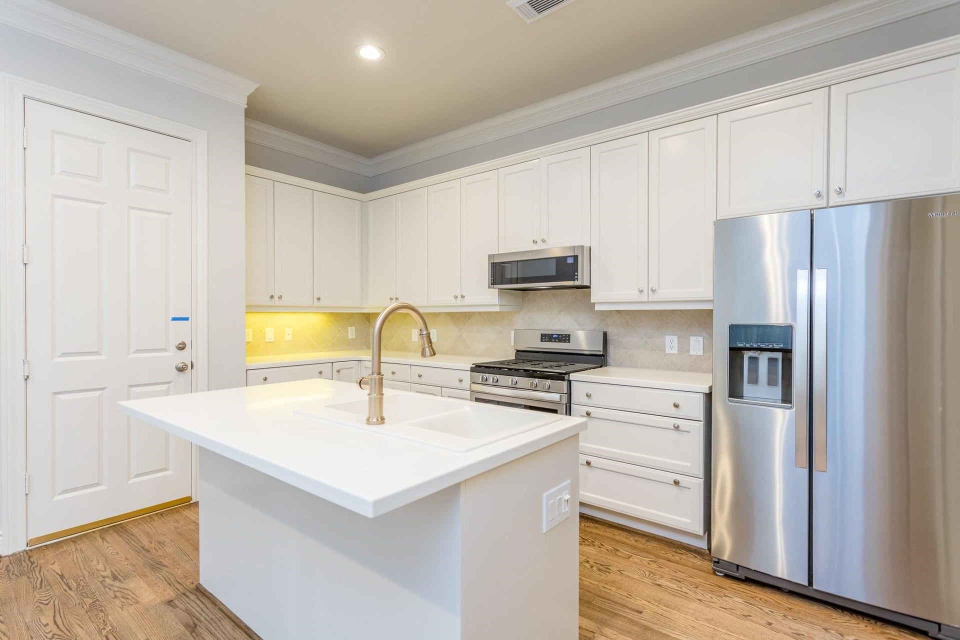 Updated kitchen with direct access to two-car garage.