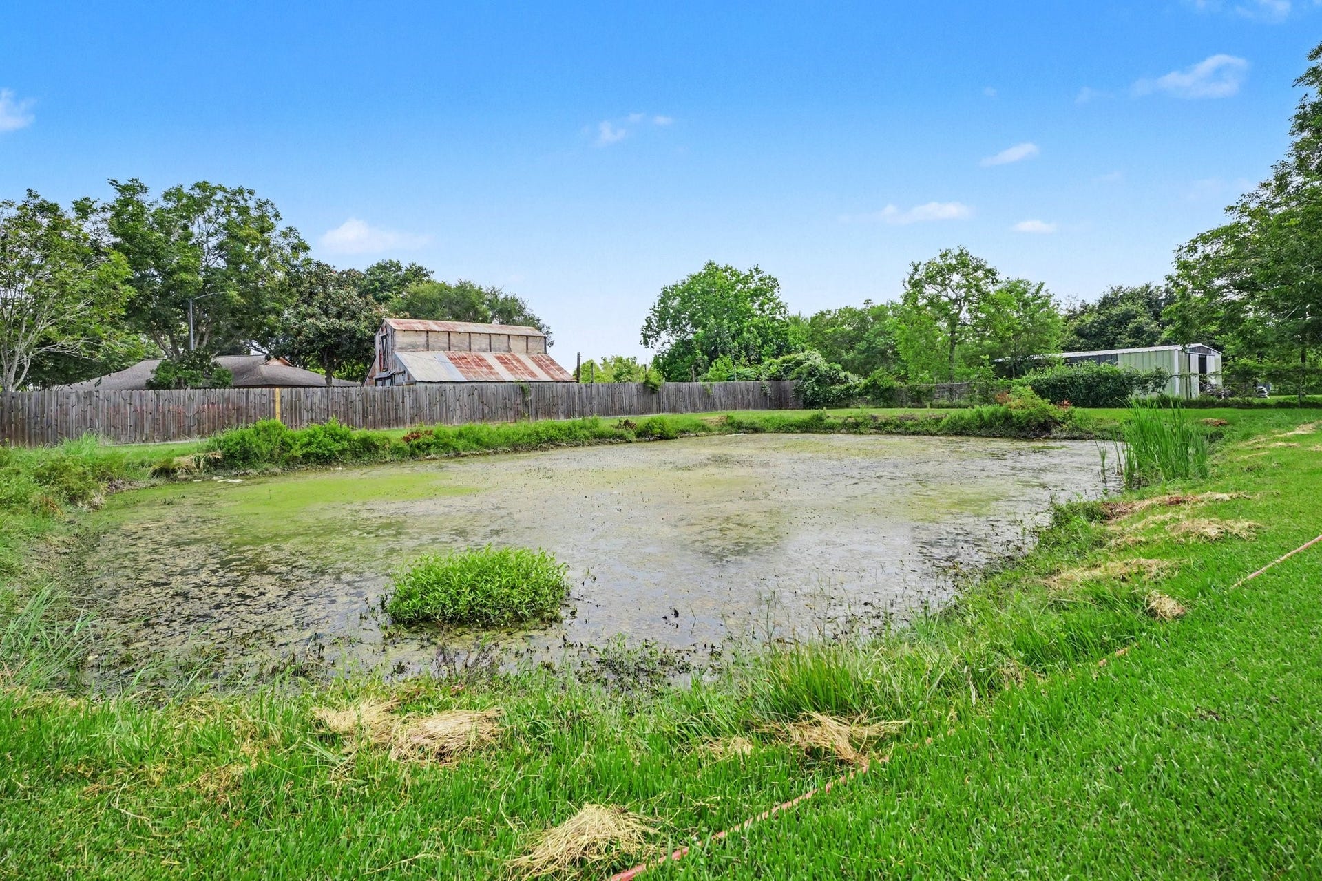 17310 Mcdonald Road, Alvin, TX 77511 Pond is the very back of home.
