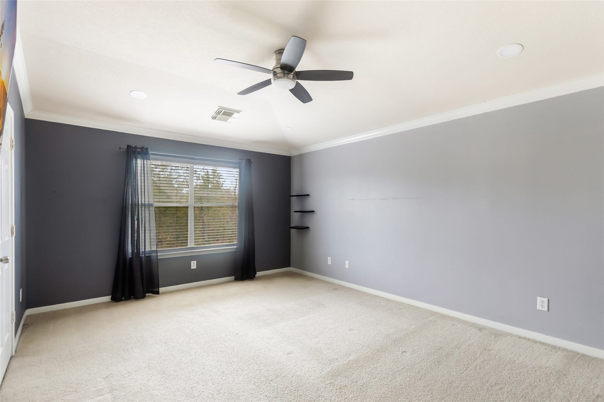 Spacious primary suite offering a comfortable place to relax and unwind.
