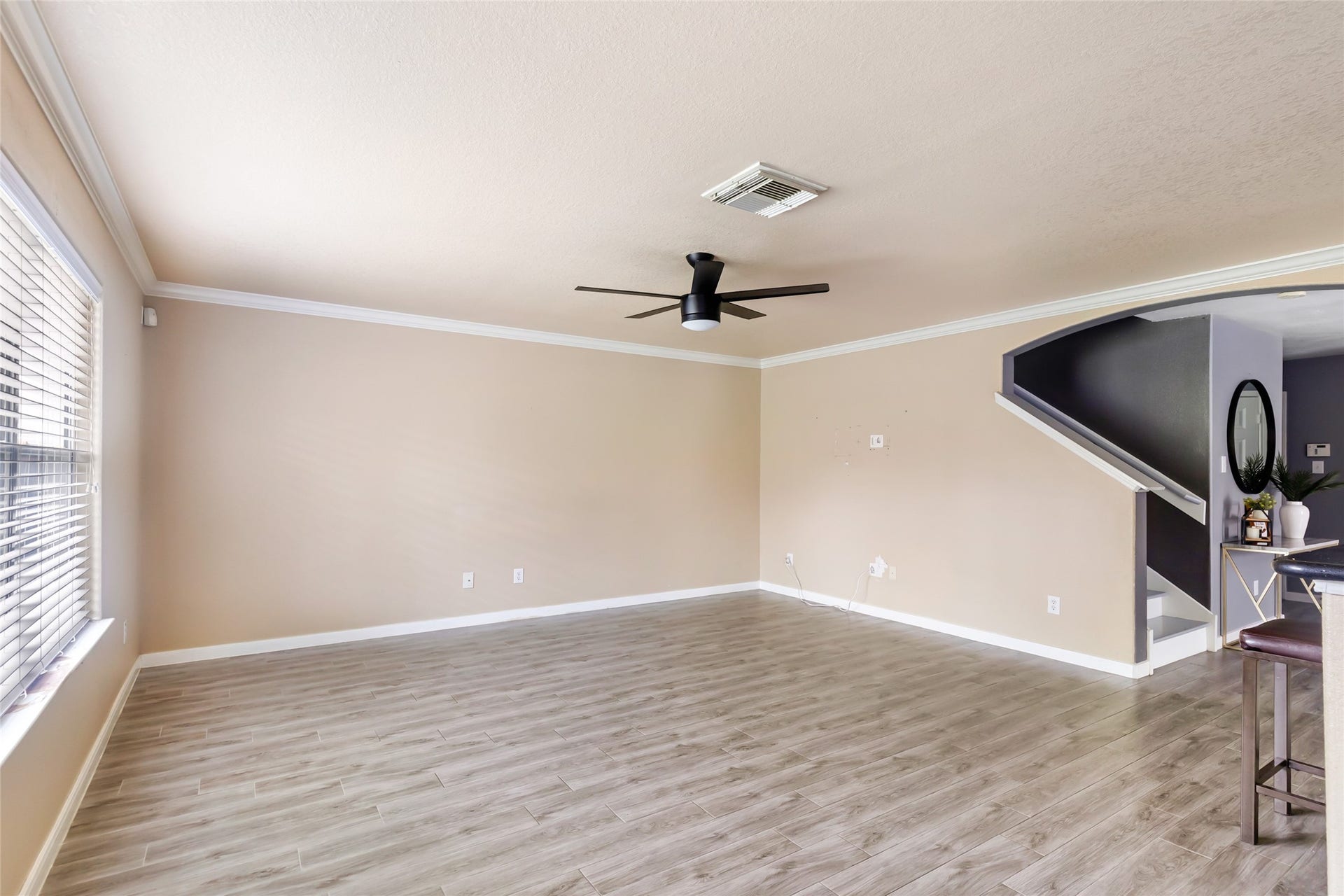 Spacious living area perfect for relaxing or entertaining family and friends.