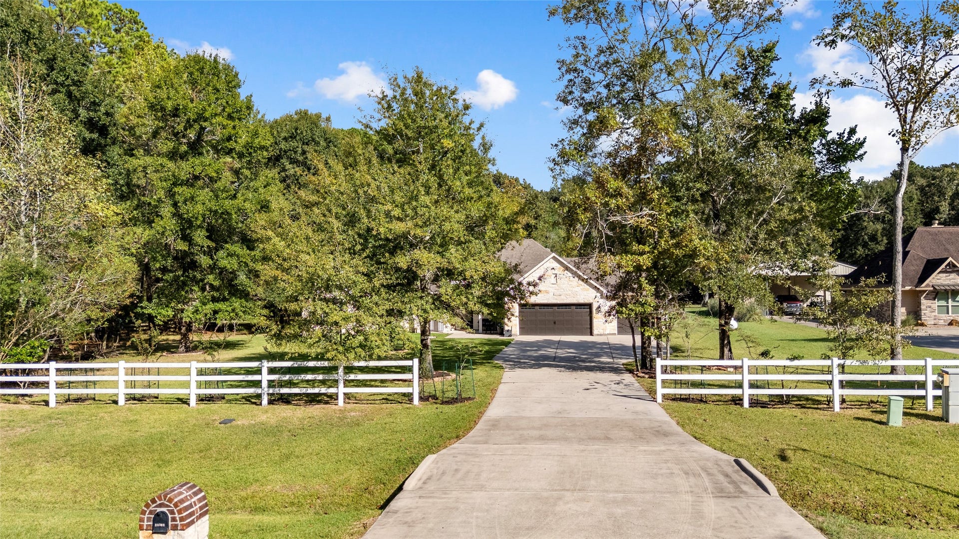 Leave the hustle and bustle behind! A picturesque, tree-lined driveway welcomes you home to the tranquility of country living.