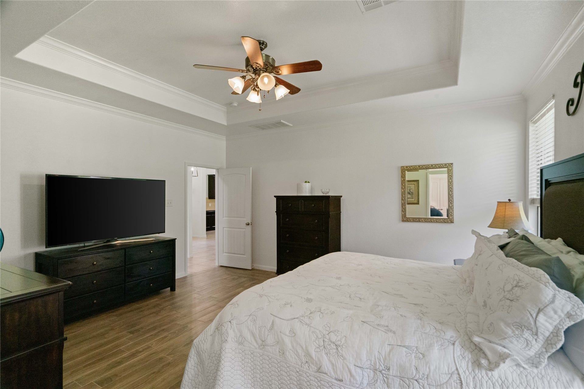 There's nothing quite like coming home to a bedroom that feels like an escape. Generous proportions and a lovely tray ceiling add to the charm.