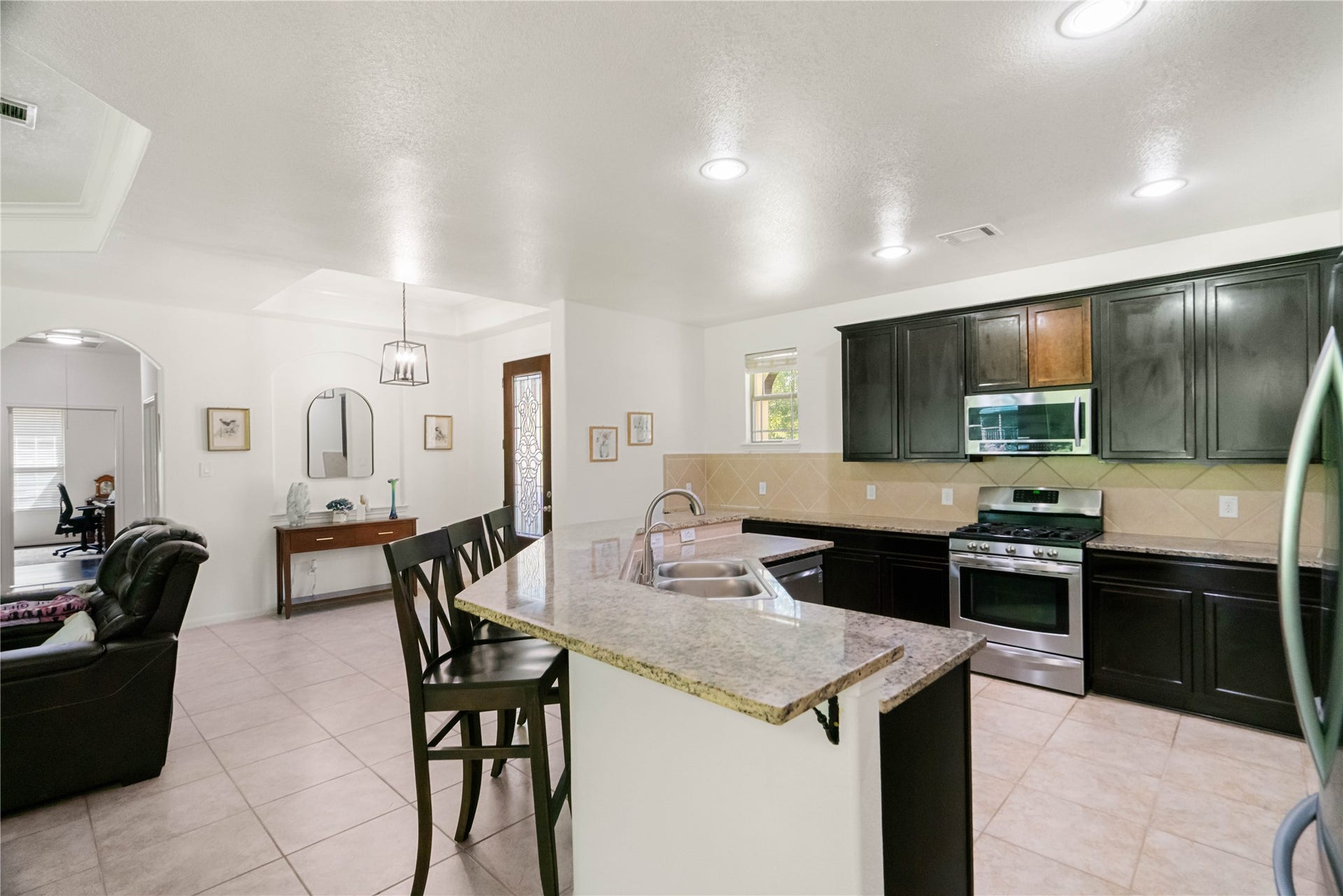 Cook, entertain, and never miss a conversation! This open kitchen keeps you connected to all the action.