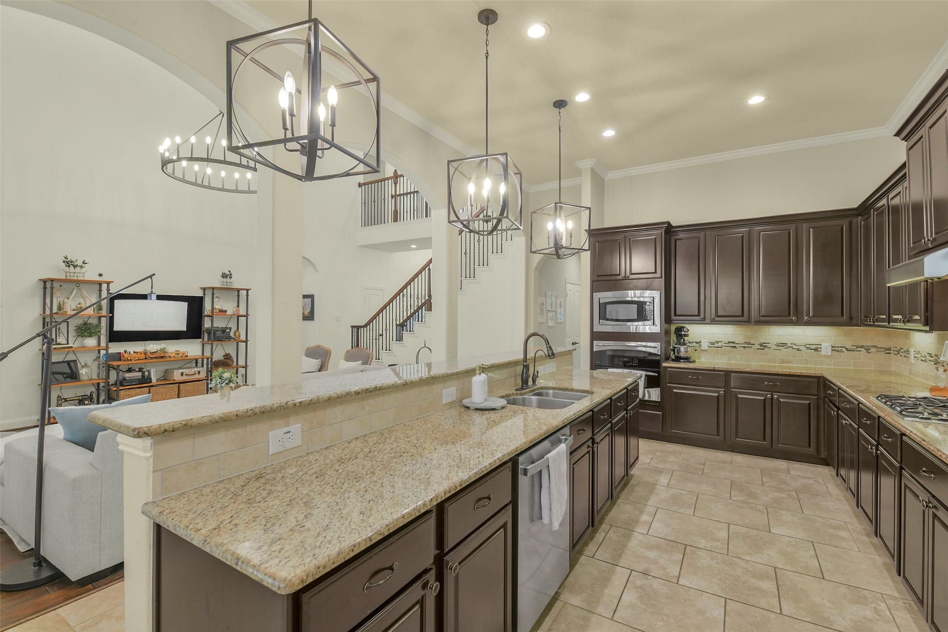 119 Finchfield Place, Montgomery, TX 77316 Well-appointed kitchen featuring generous counter space, rich cabinetry, and a large center island.
