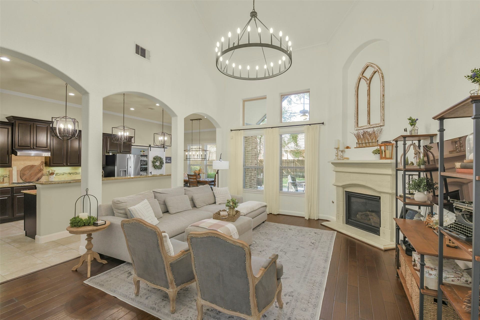 119 Finchfield Place, Montgomery, TX 77316 Spacious family room with soaring ceilings, fireplace, and an open layout connecting to the kitchen.