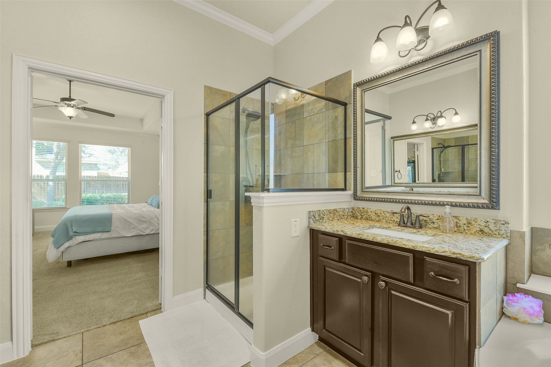 119 Finchfield Place, Montgomery, TX 77316 Primary bathroom featuring a glass-enclosed shower, double vanity, and elegant finishes.