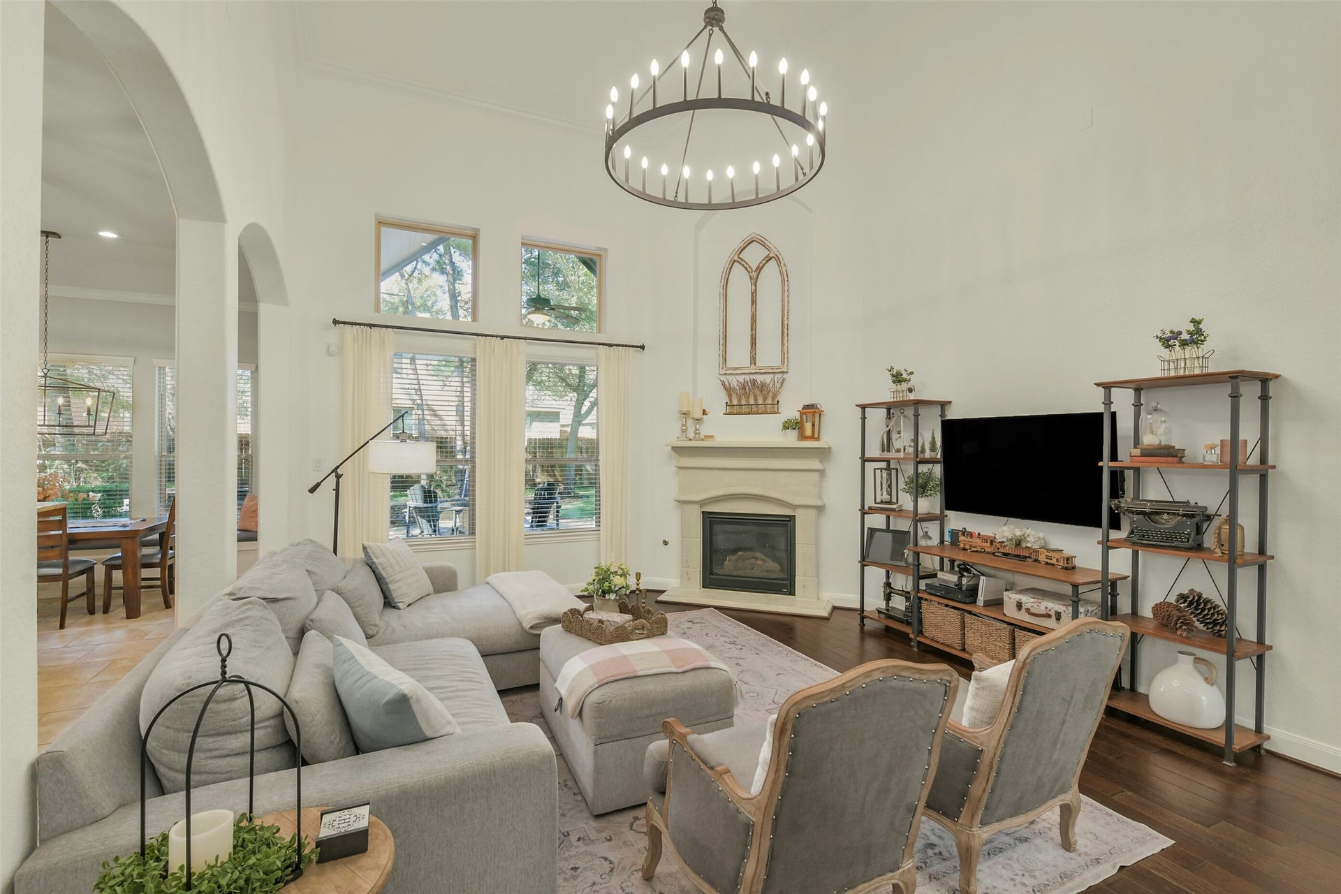 119 Finchfield Place, Montgomery, TX 77316 Bright and inviting living area featuring abundant natural light, a fireplace, and generous seating space.
