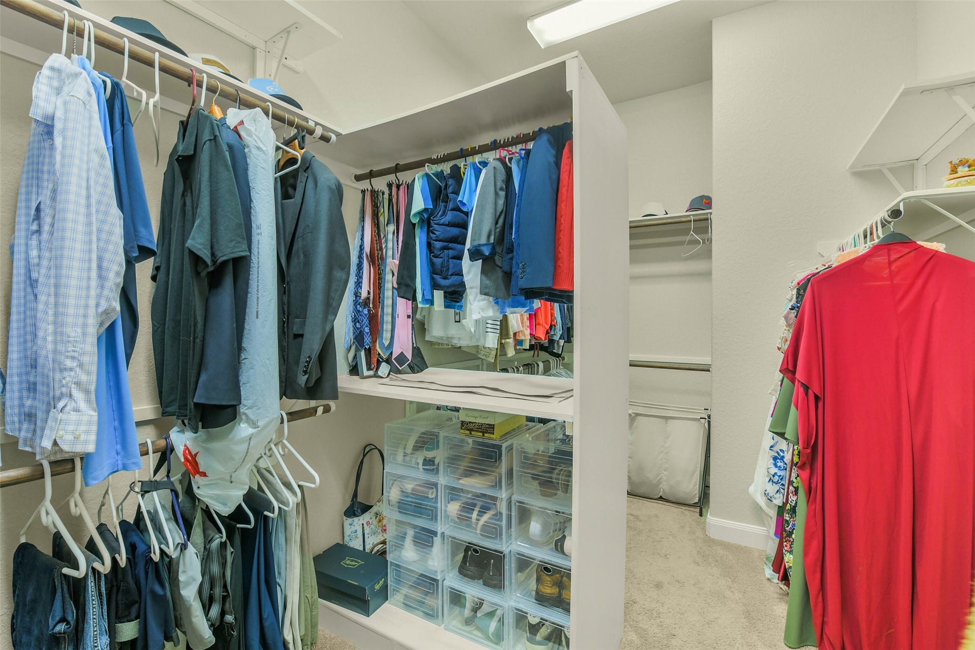 119 Finchfield Place, Montgomery, TX 77316 Spacious walk-in closet with built-in shelving and abundant hanging storage.