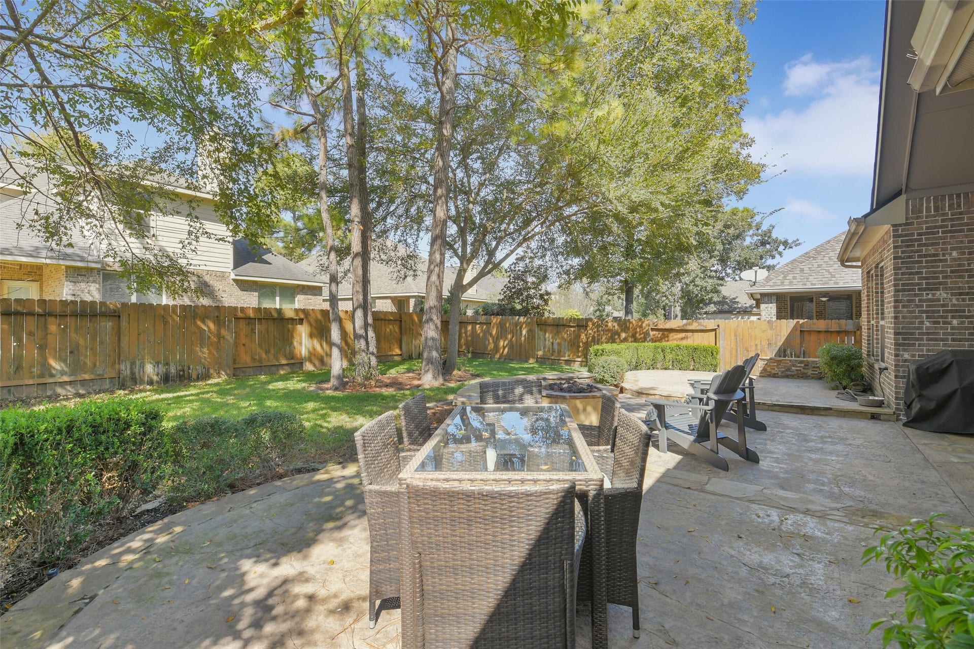 119 Finchfield Place, Montgomery, TX 77316 Beautiful outdoor entertaining area featuring an inviting patio and peaceful backyard views.