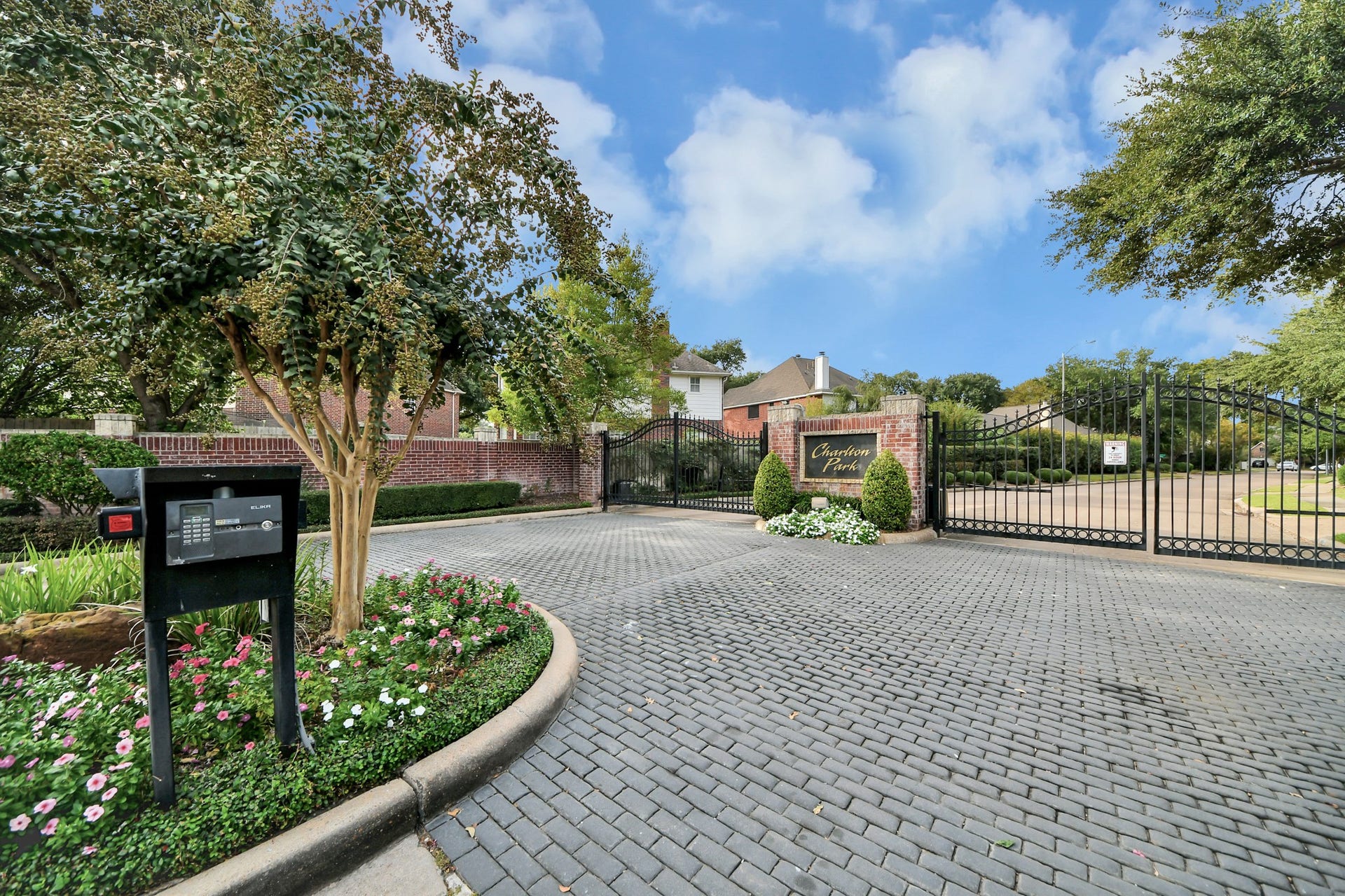 Charlton Park, a gated community in the Energy Corridor with a beautifully landscaped entrance.