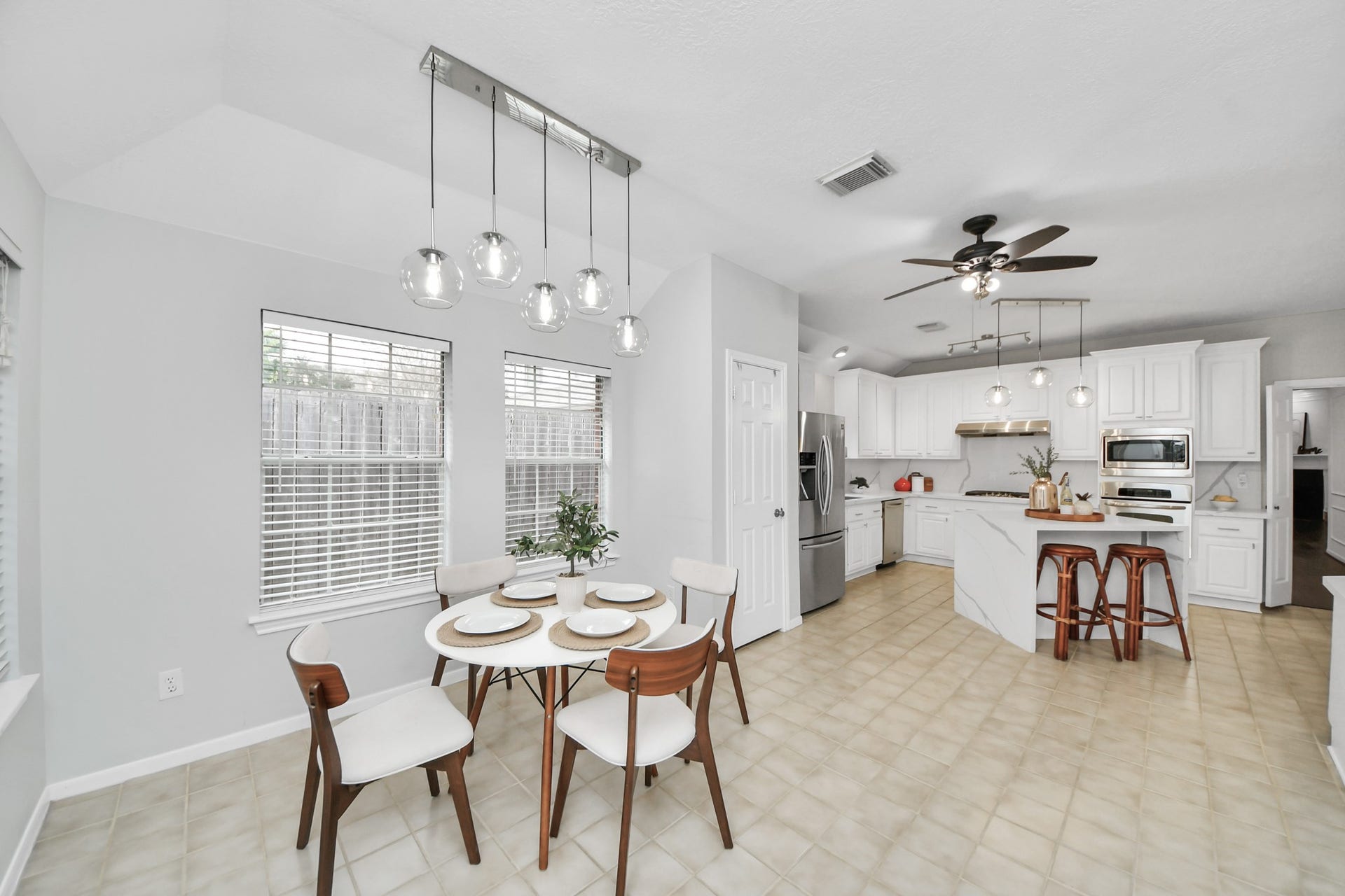 A bright breakfast area right off the kitchen, with large windows and plenty of natural light. A nice spot for everyday meals or your morning coffee.