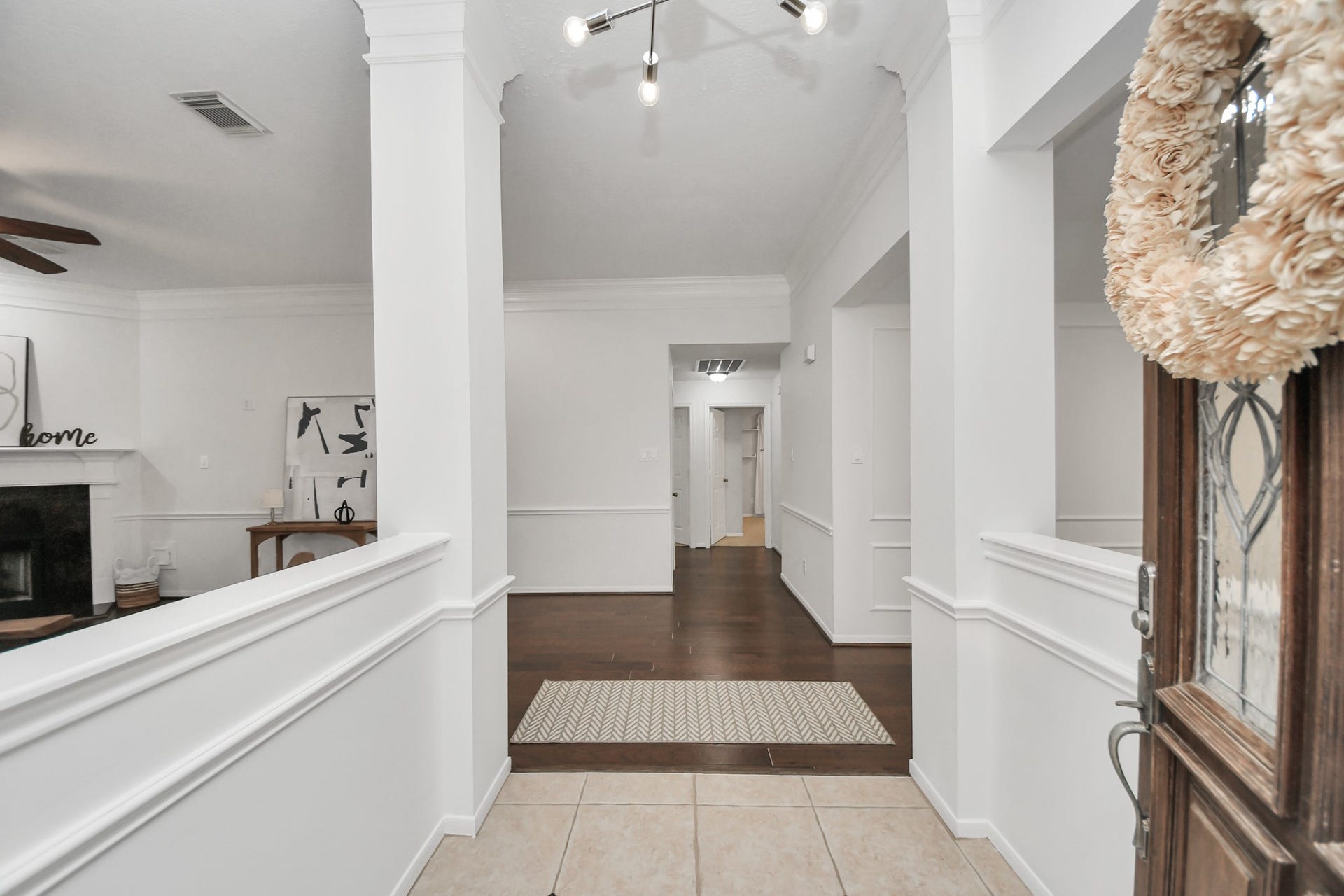As you walk in, youll notice the high ceilings, fresh paint, and wood floors. The living room is to your left and the dining room to your right.