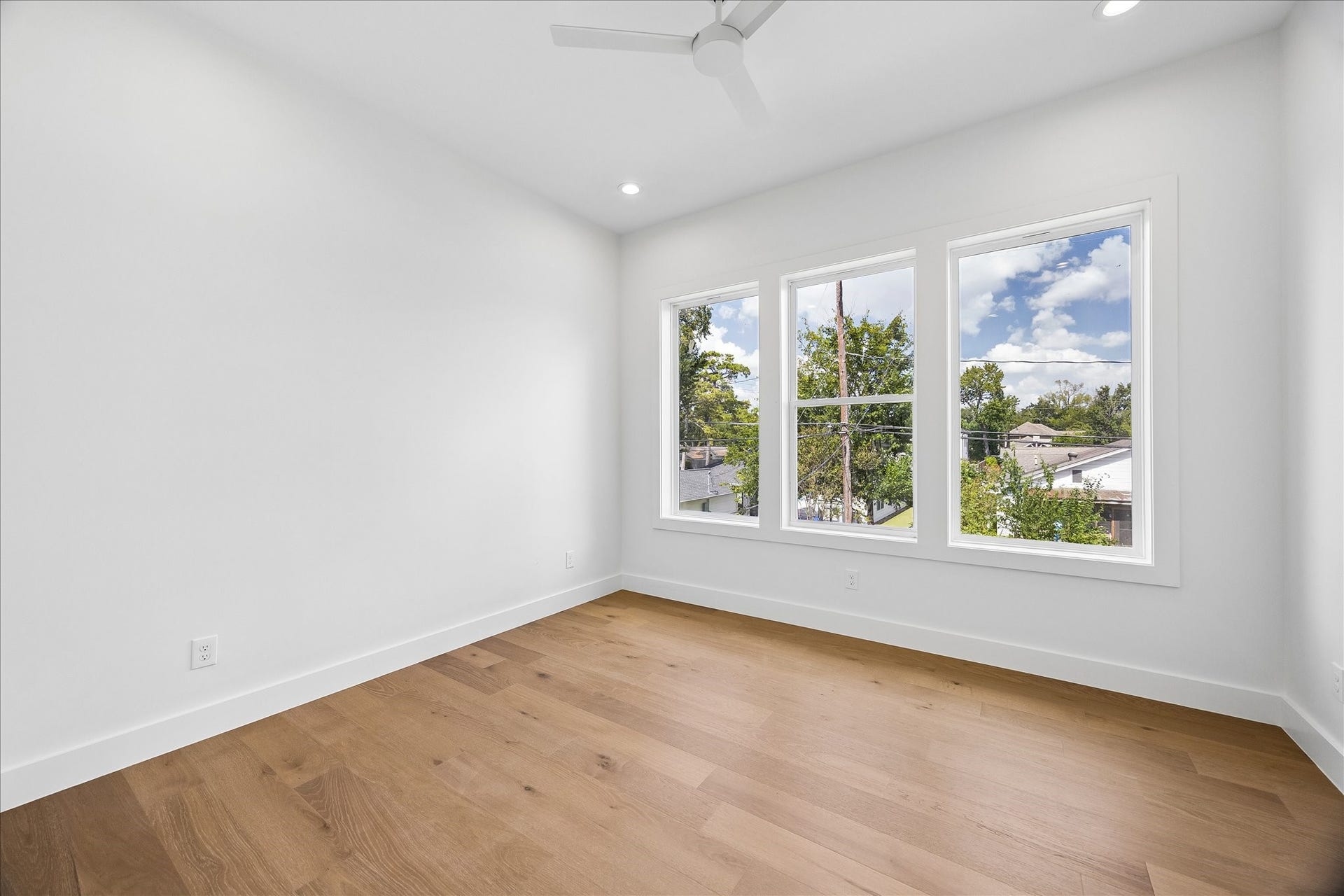 1726 Chantilly Lane, Houston, TX 77018 This secondary bedroom pairs wood flooring with light walls and windows for natural light. The straightforward layout offers flexibility for sleeping, studying or guests.