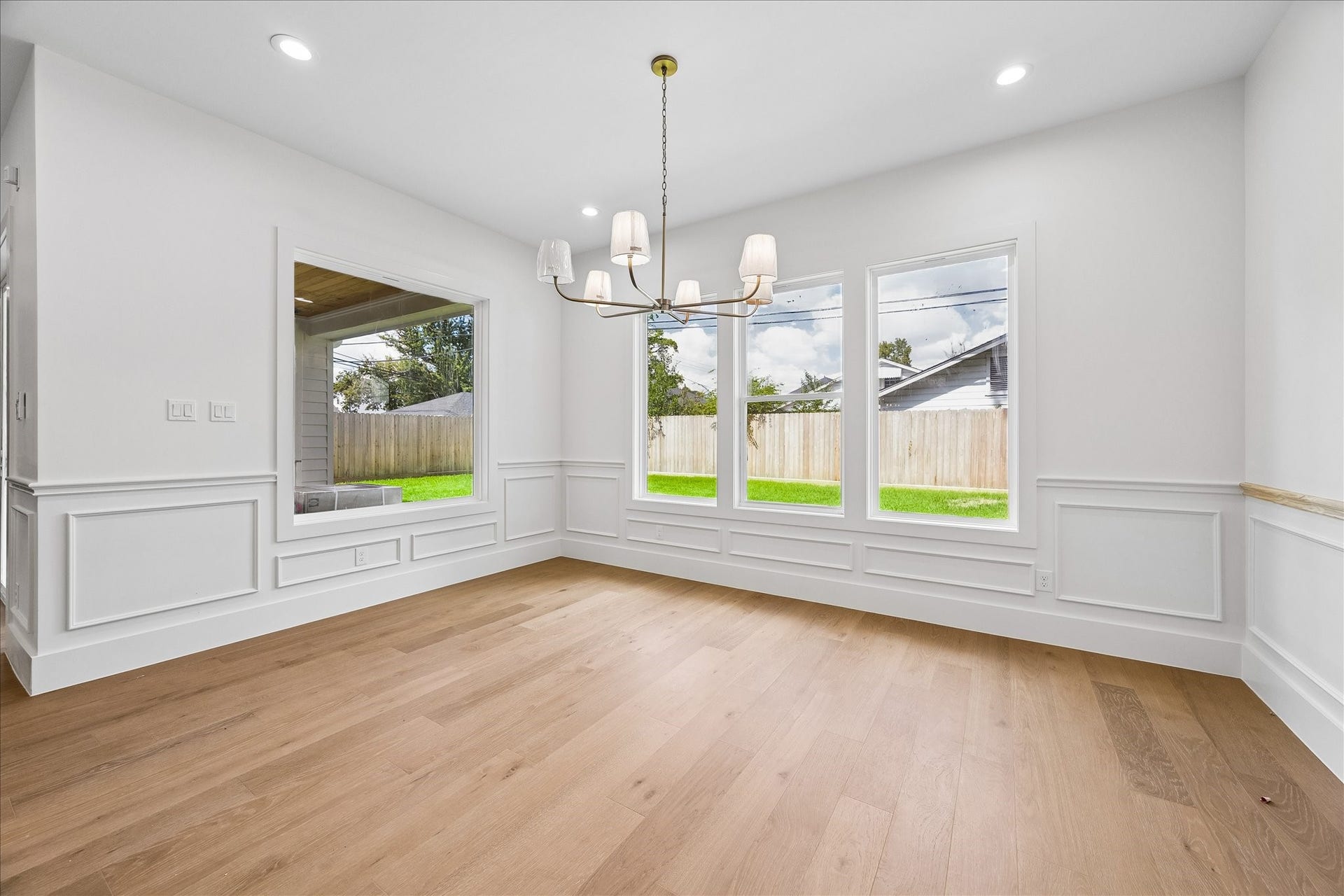 1726 Chantilly Lane, Houston, TX 77018 Windows brighten the dining area, where paneled walls and wood flooring continue the finish palette. Its position beside the kitchen keeps daily meals and entertaining connected.