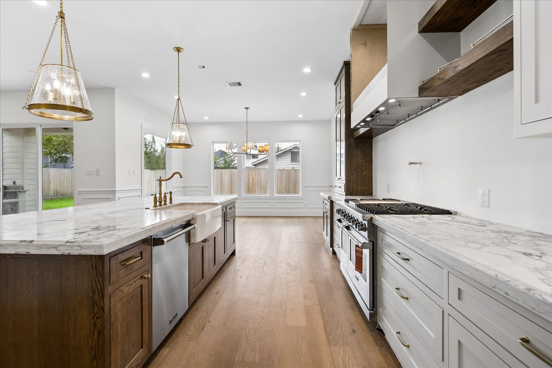 1726 Chantilly Lane, Houston, TX 77018 The kitchen flows directly toward the dining area. The island, range wall and surrounding cabinetry keep the main work zones close while preserving an open connection to the rest of the first floor.