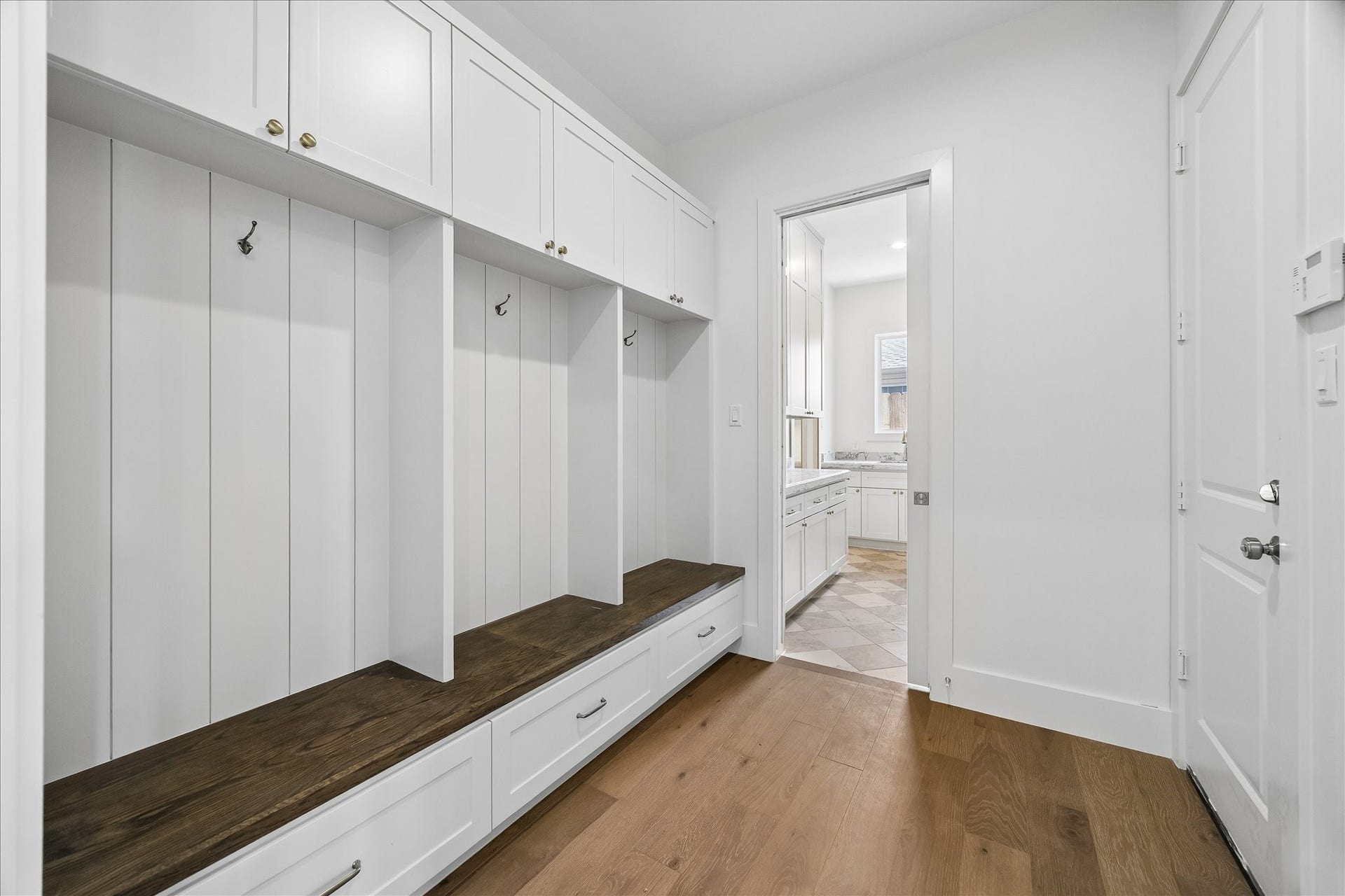 1726 Chantilly Lane, Houston, TX 77018 A built-in bench, hooks and open cubbies organize the mudroom. Upper and lower storage provide a place for bags, shoes and everyday essentials.