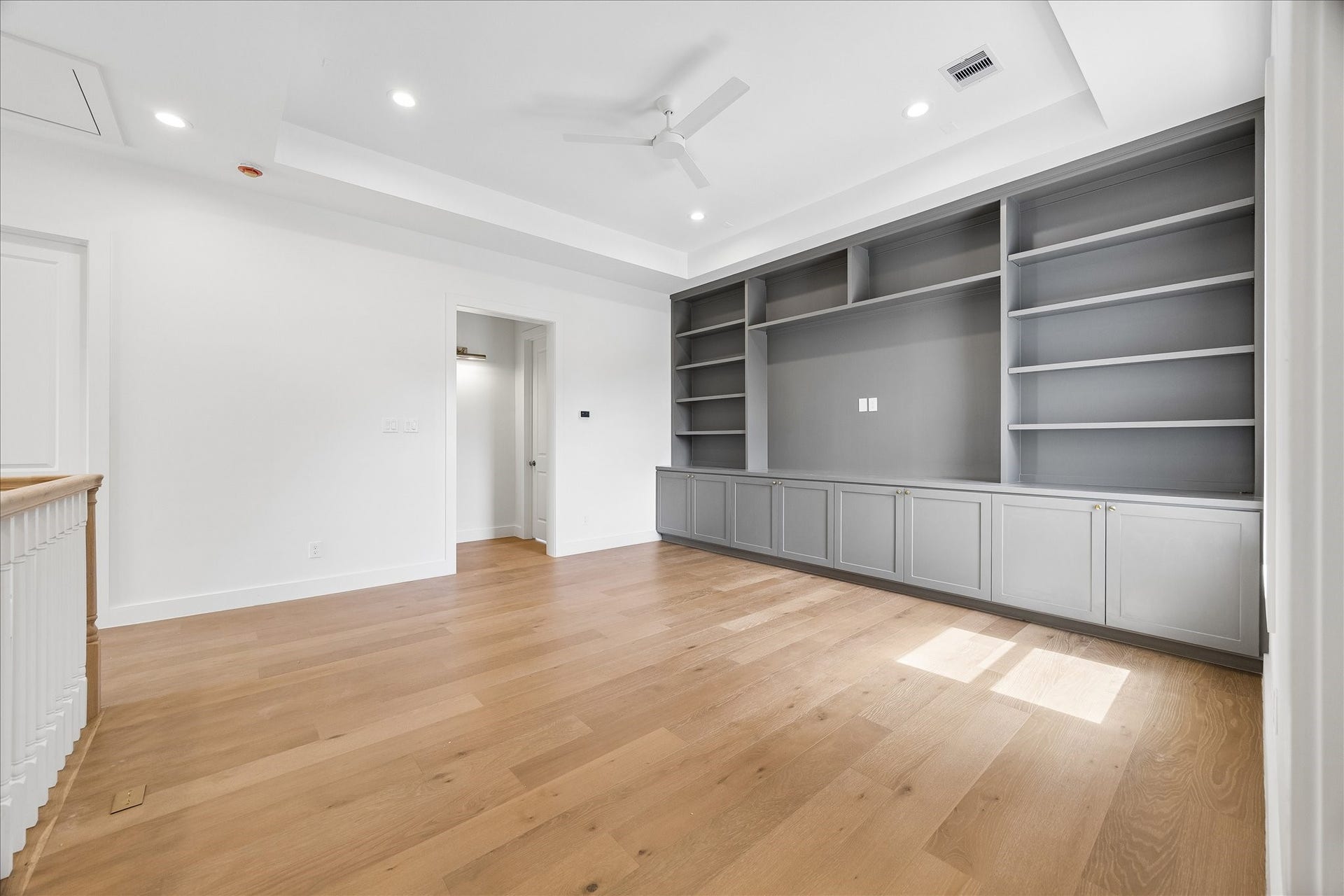 1726 Chantilly Lane, Houston, TX 77018 Built-in cabinets and open shelving anchor the game room. Nearby windows bring natural light to a flexible space for relaxing, games or a second seating area.