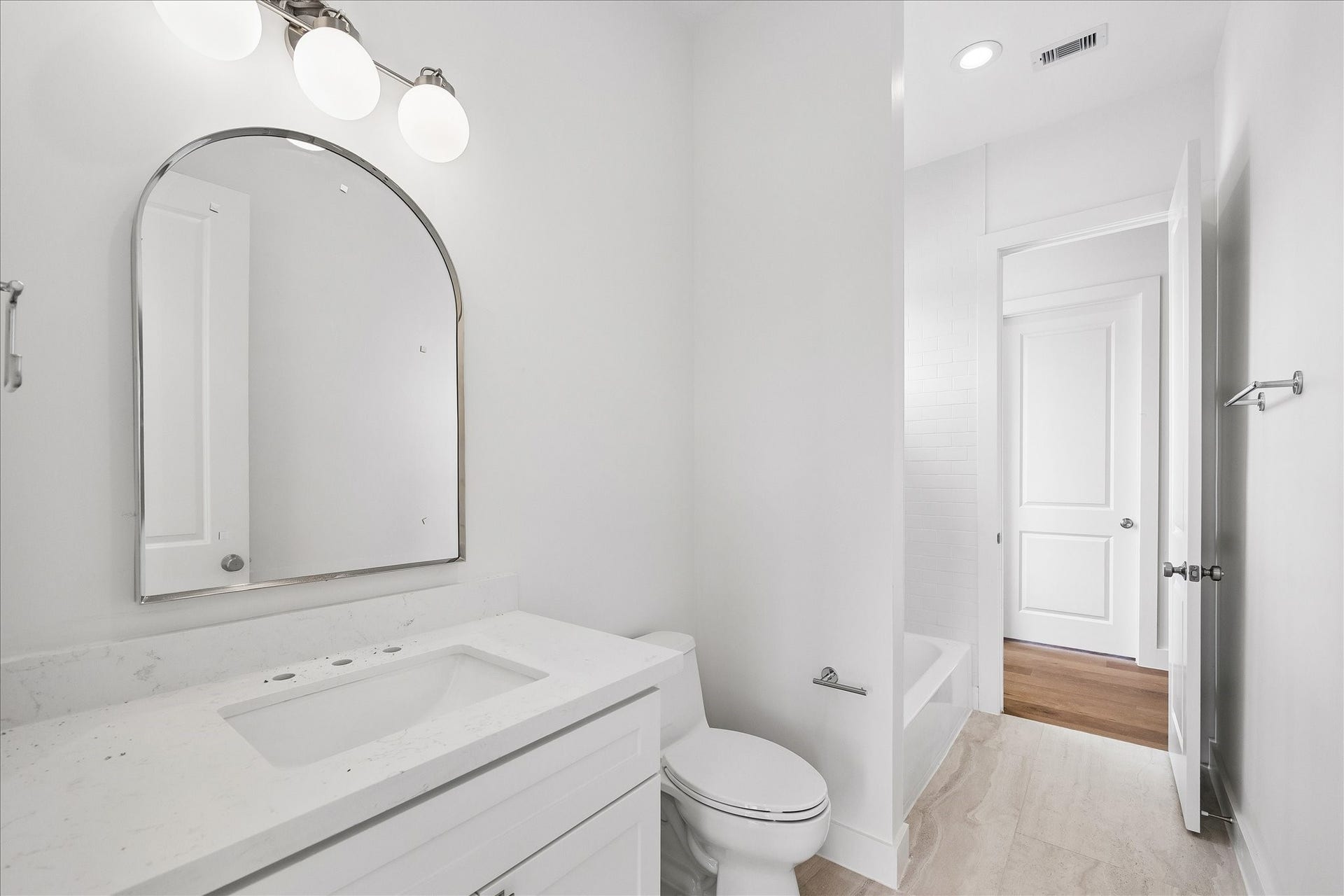 1726 Chantilly Lane, Houston, TX 77018 This additional bathroom view highlights the vanity and its storage. Light finishes and warm fixture accents continue the homes cohesive interior palette.