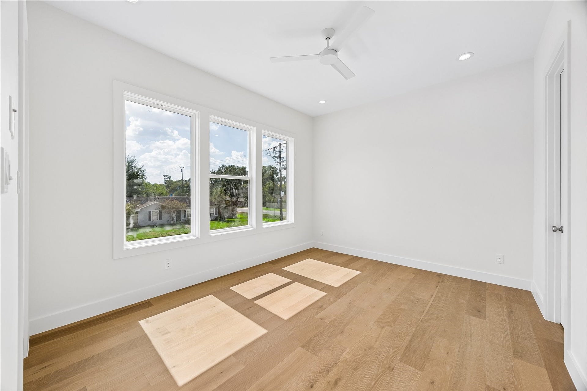 1726 Chantilly Lane, Houston, TX 77018 Another secondary bedroom offers wood flooring and natural light from its windows. The neutral finishes provide a flexible backdrop for a variety of furniture layouts.
