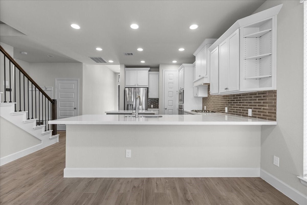 19007 Satsuma Ridge Drive, Manvel, TX 77578 Dining area open to kitchen and living room.