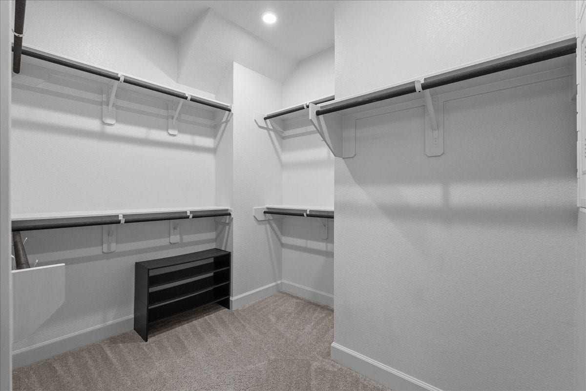 19007 Satsuma Ridge Drive, Manvel, TX 77578 Large primary walk-in closet.