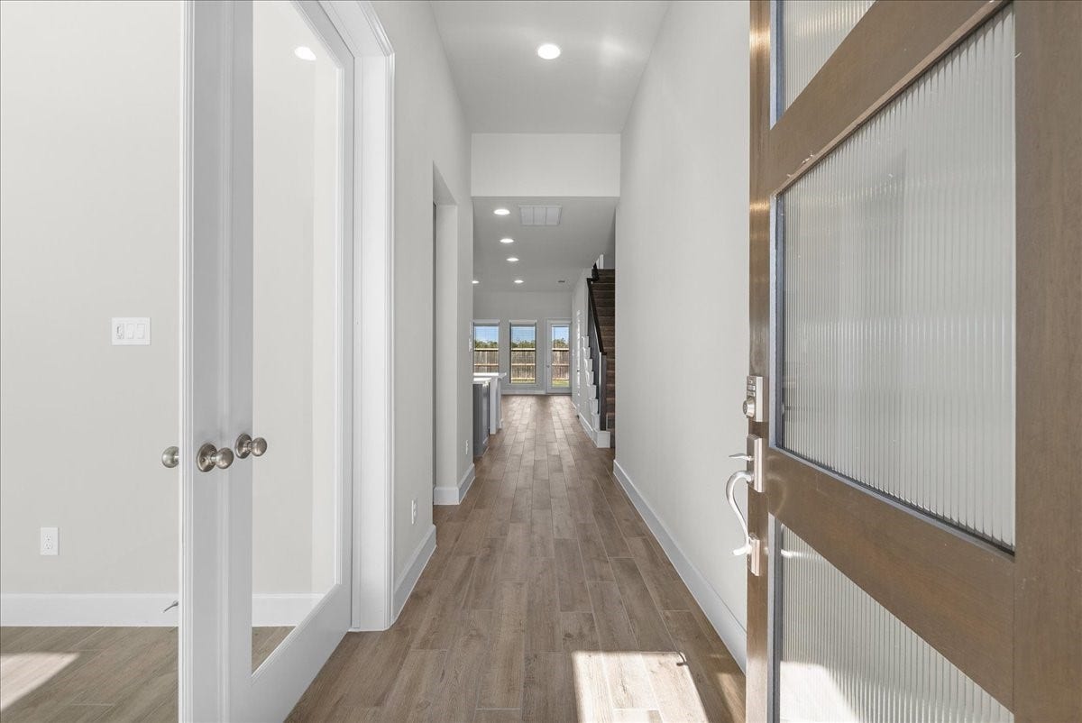 19007 Satsuma Ridge Drive, Manvel, TX 77578 Enter into an inviting entry where working from home is quiet and peaceful on the left.