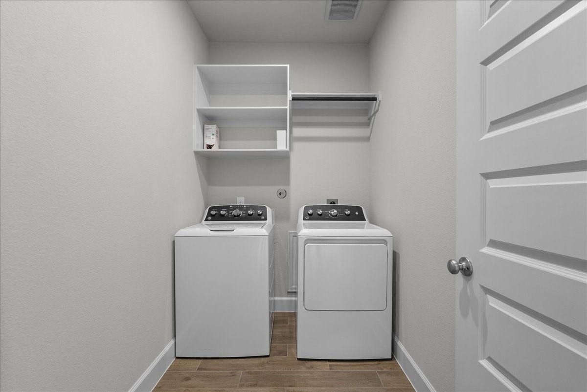 19007 Satsuma Ridge Drive, Manvel, TX 77578 Utility room is on the first floor next to the study. Washer and dryer included with the home.