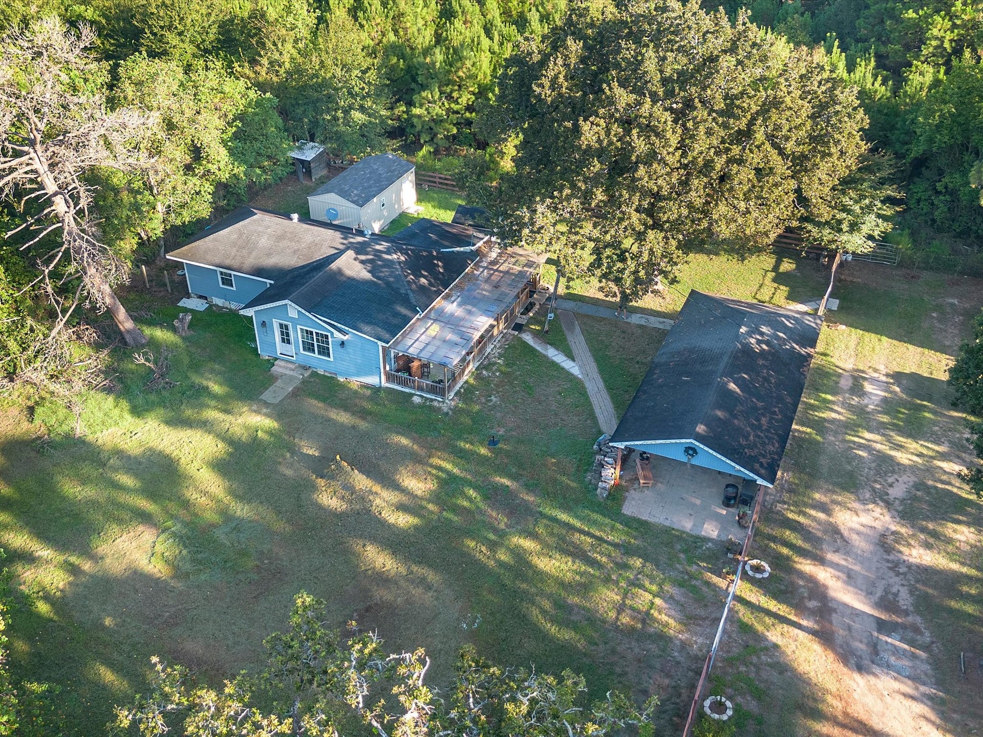 32403 Dobbin Huffsmith Road, Magnolia, TX 77354 Aerial view of Structures 3 and 4. Structure 3 features a 2-bedroom, 2-bath layout, while Structure 4 offers a 1-bedroom layout, providing additional space and flexibility on the property.