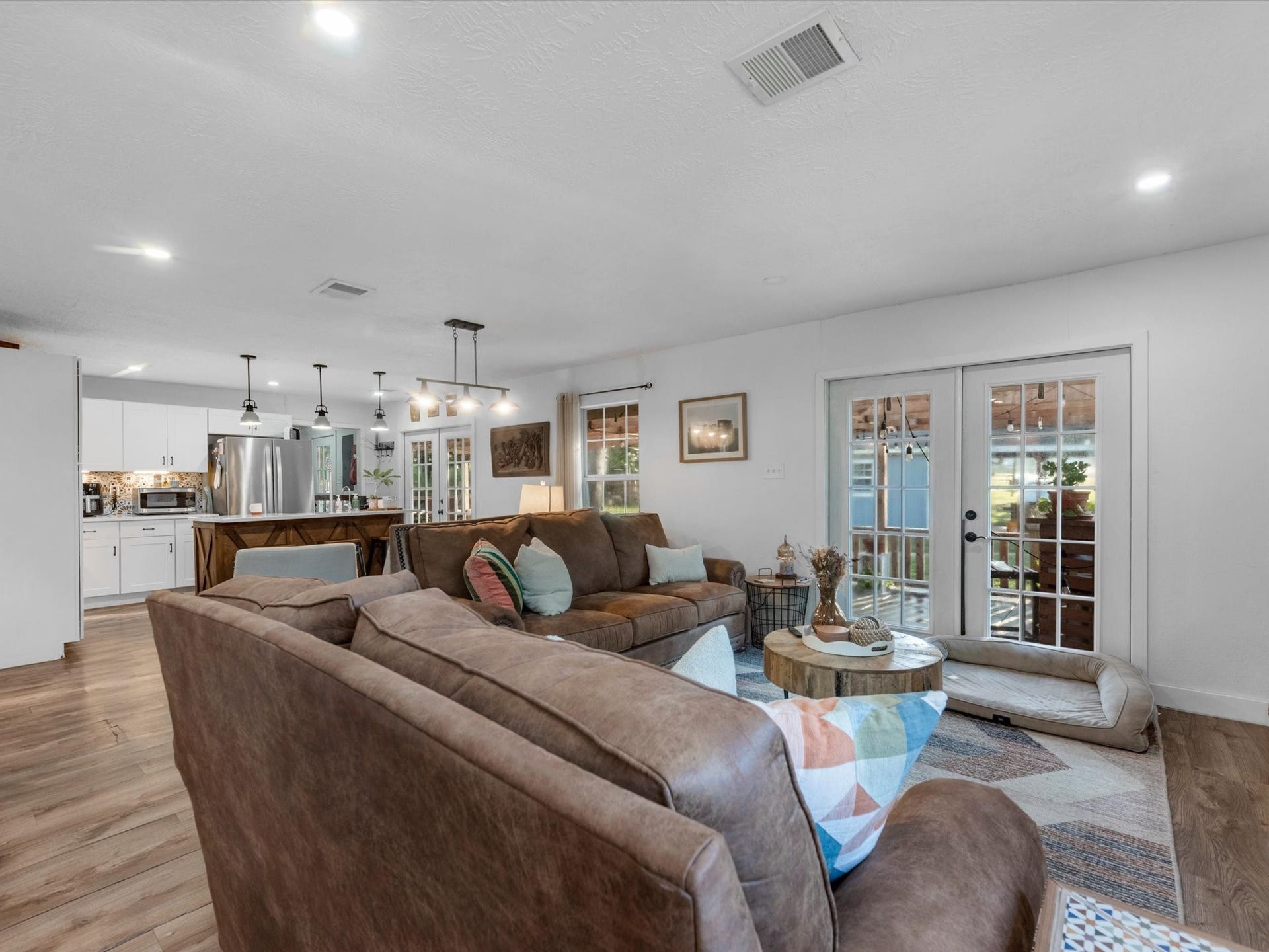 32403 Dobbin Huffsmith Road, Magnolia, TX 77354 Open-concept living area flowing seamlessly into the kitchen and dining space, creating a spacious layout ideal for everyday living and entertaining.