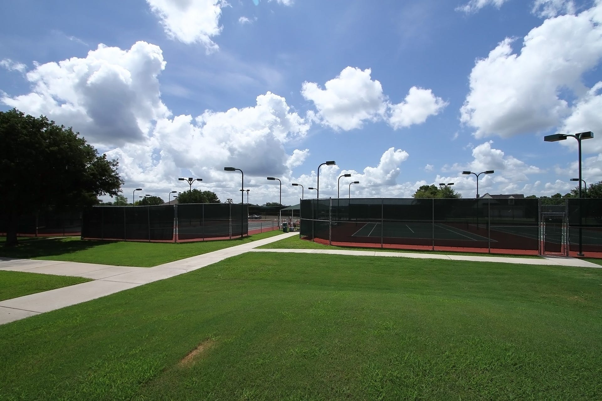 26 Winthrop Harbor Court, Montgomery, TX 77356 Perfectly maintained tennis courts for every player level.