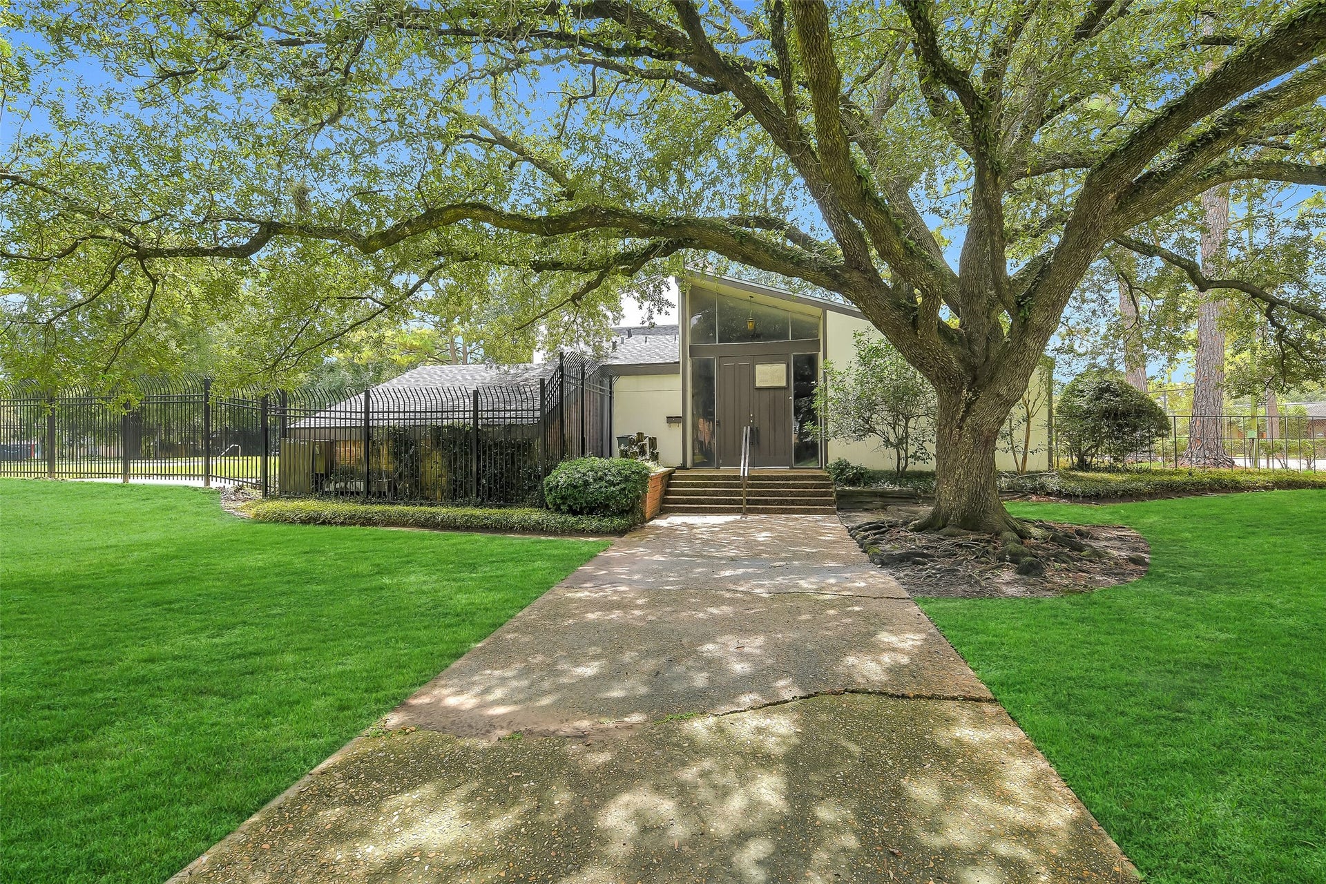 Beautiful mature trees and green space give the community a sense of separation from the city around it