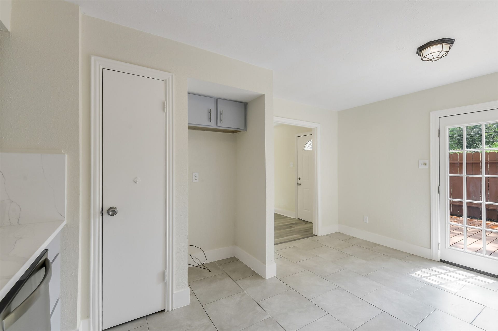 An easy everyday setup with room for a breakfast table, extra storage and French doors leading directly to the private patio