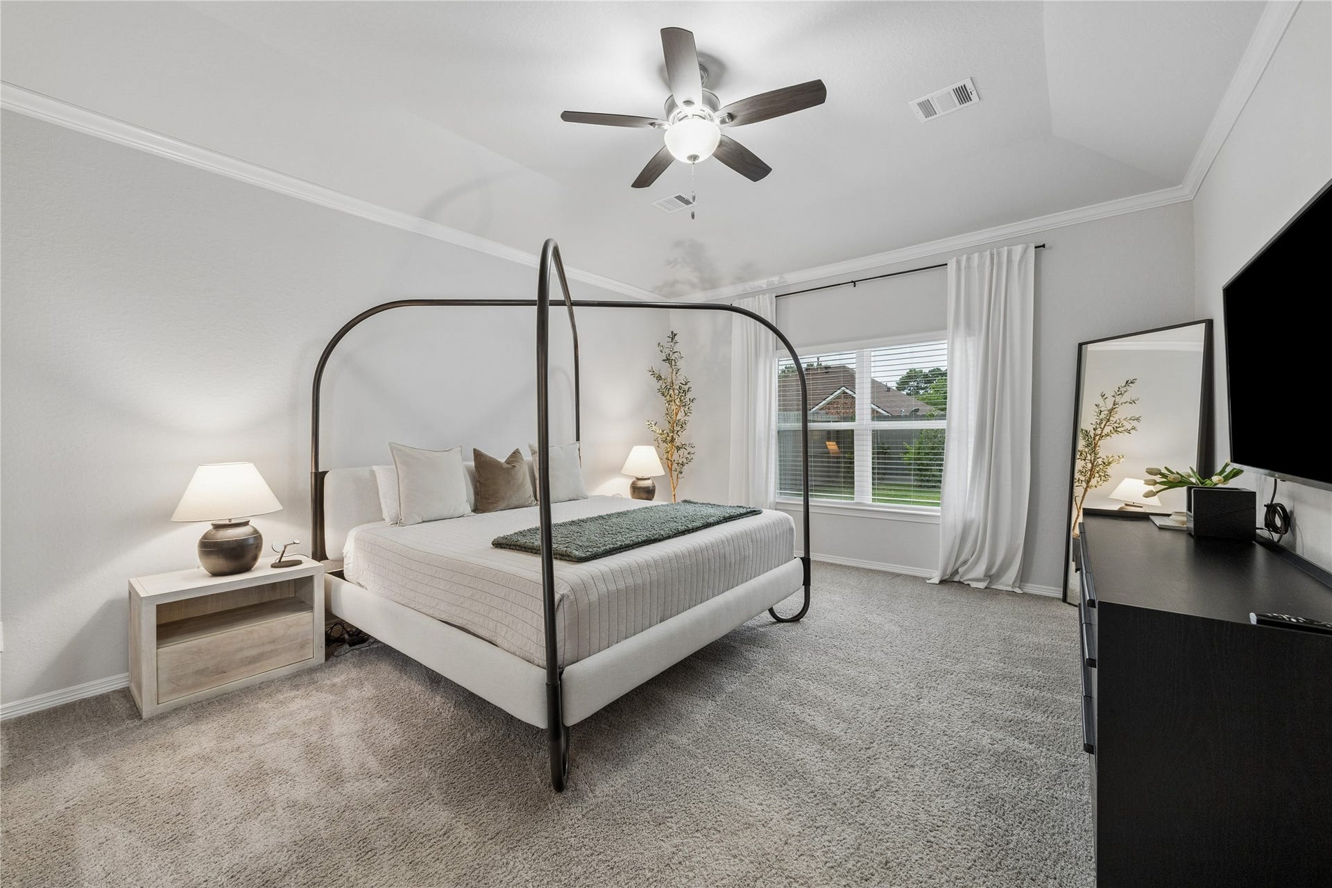 14231 Archer County Trail, Cypress, TX 77429 14x17 primary bedroom near the back of the house, tall slanted ceilings, window treatments.