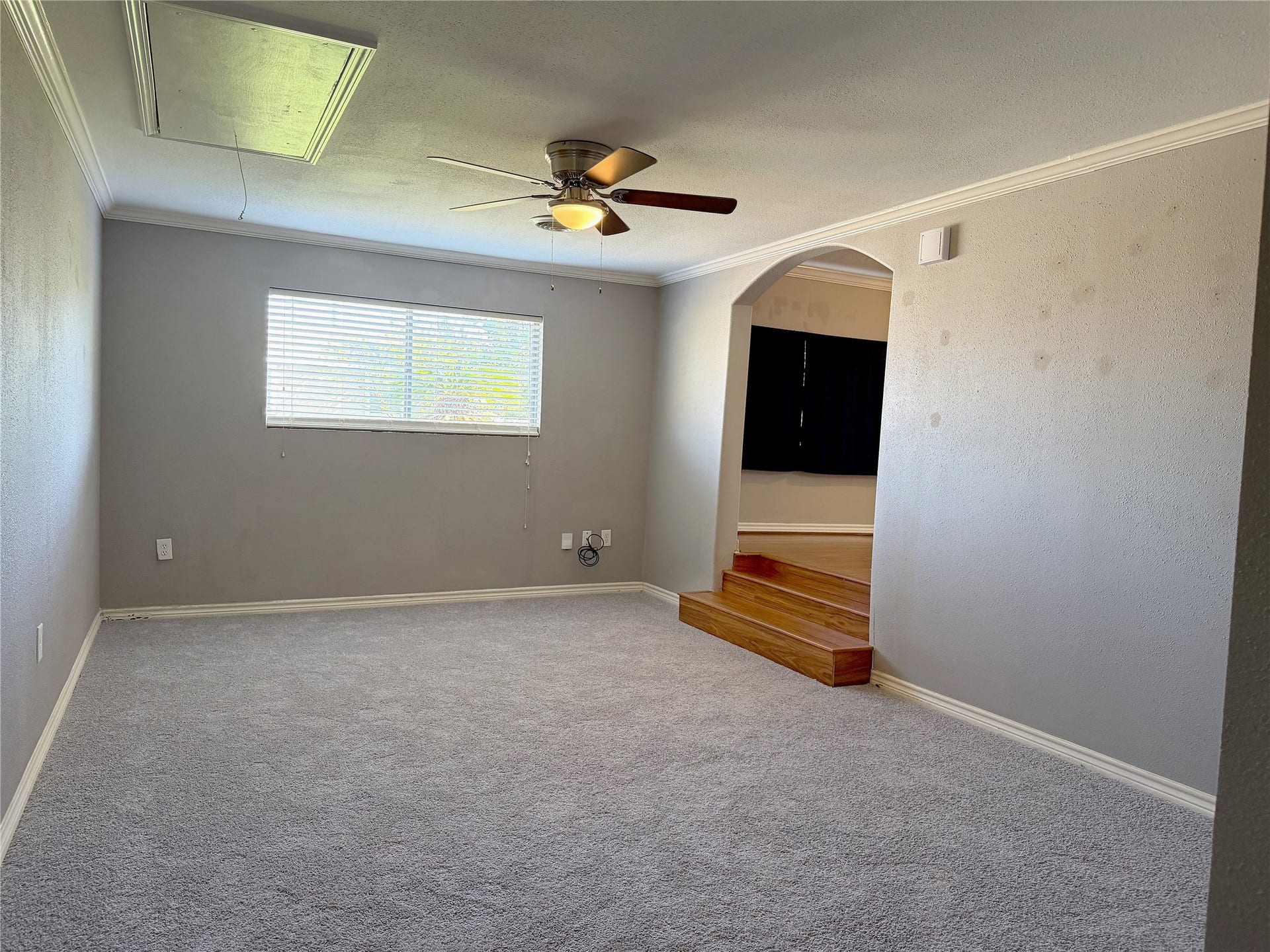1302 N Avenue R, Freeport, TX 77541 Step-down den features carpeting and offers a separate, comfortable living area within the home.