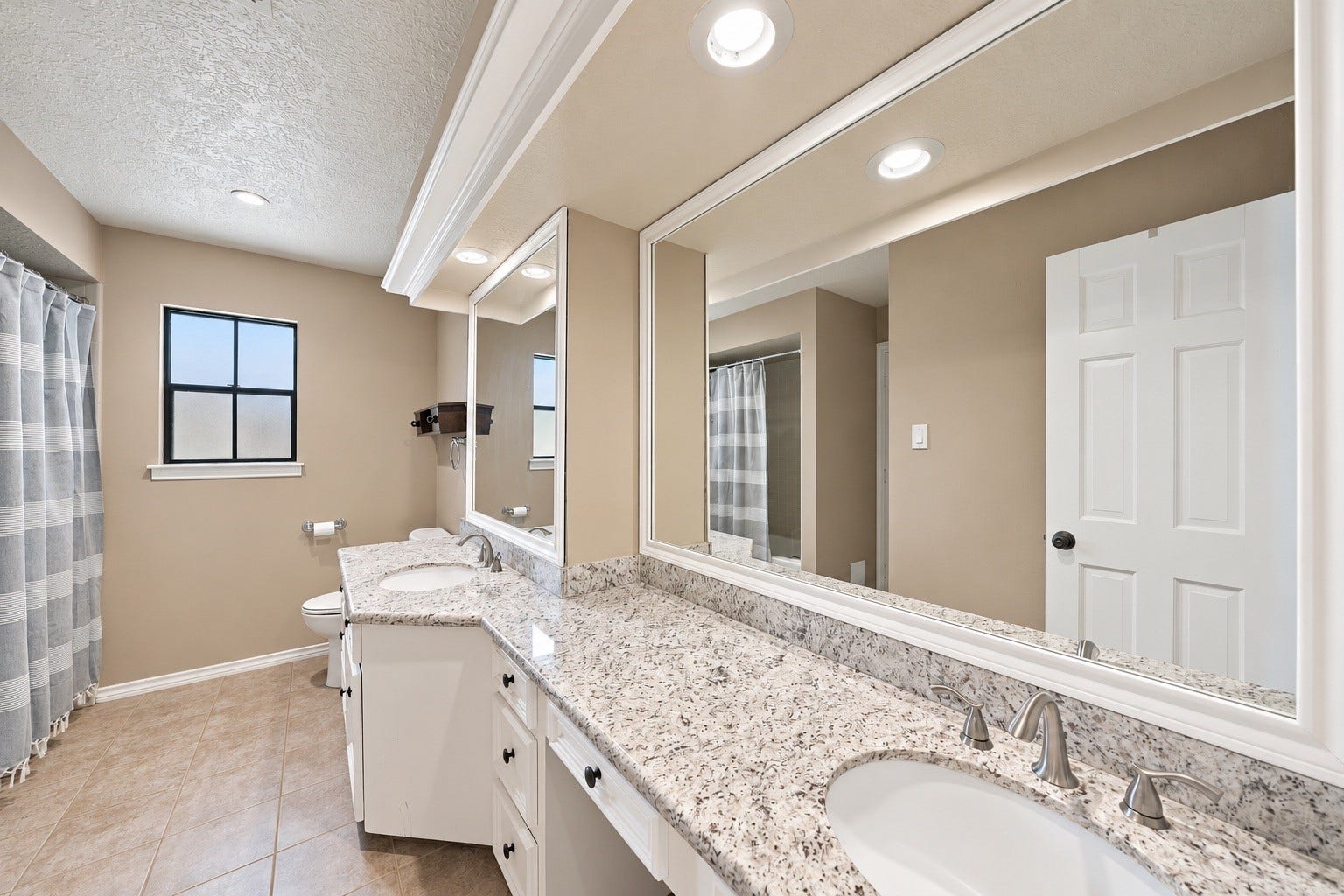 Two upstairs shared baths, double sinks